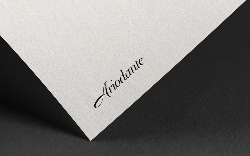 Close-up of a white textured paper with the word "Triodante" printed in elegant black script.