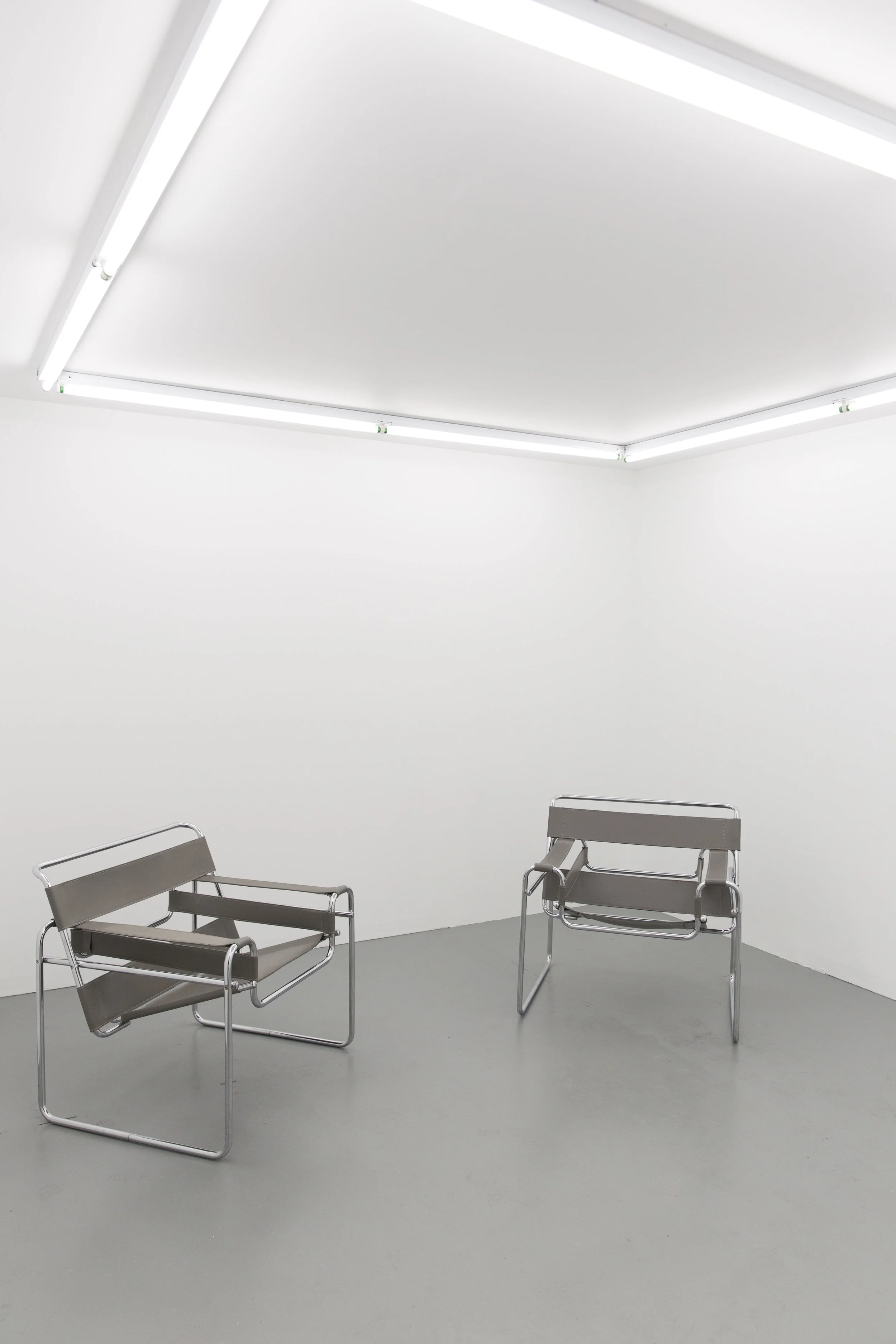 One of two Marcel Breuer designed Wassily Chairs from ISCA Module , 2016, plywood, drywall, fluorescent lights, 12 x 12 x 8 feet