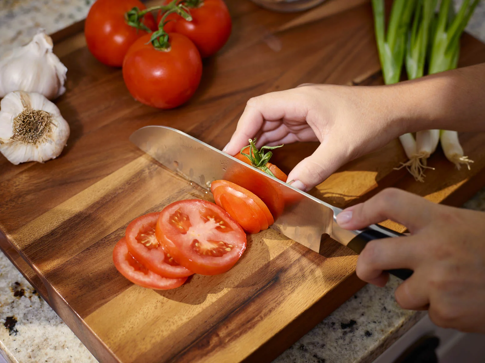 Sliced Tomatoes on Wood Cutting Board