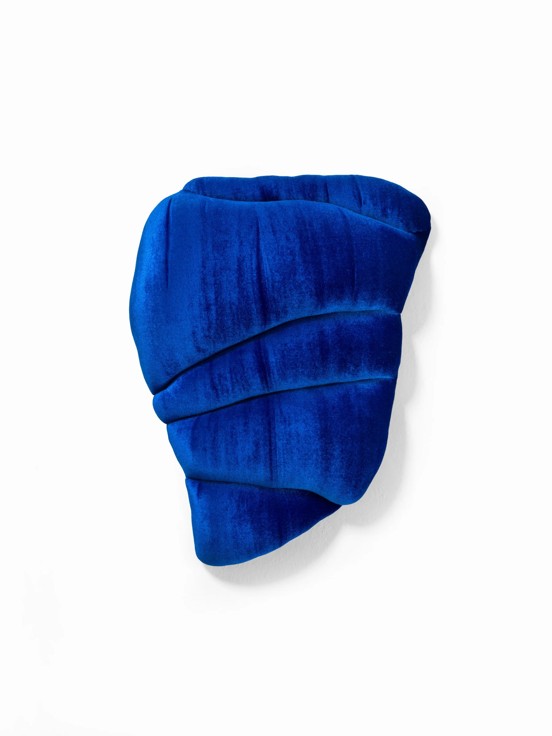 a wealth of silence 2025 Velvet and stuffing on custom shaped wood panel. 20 × 15 × 5 in.