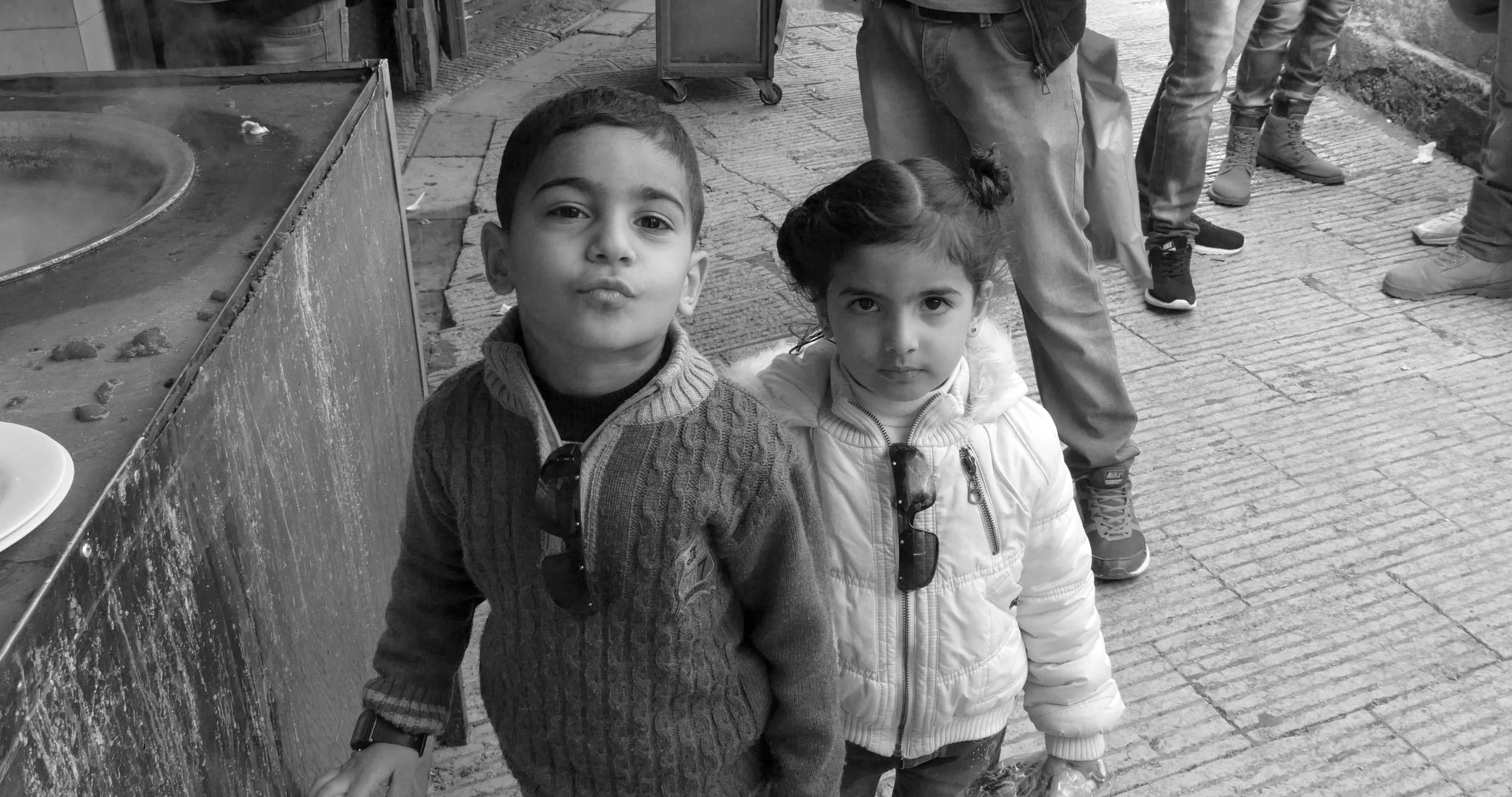 Twins in Nablus next to the kanafeh shop