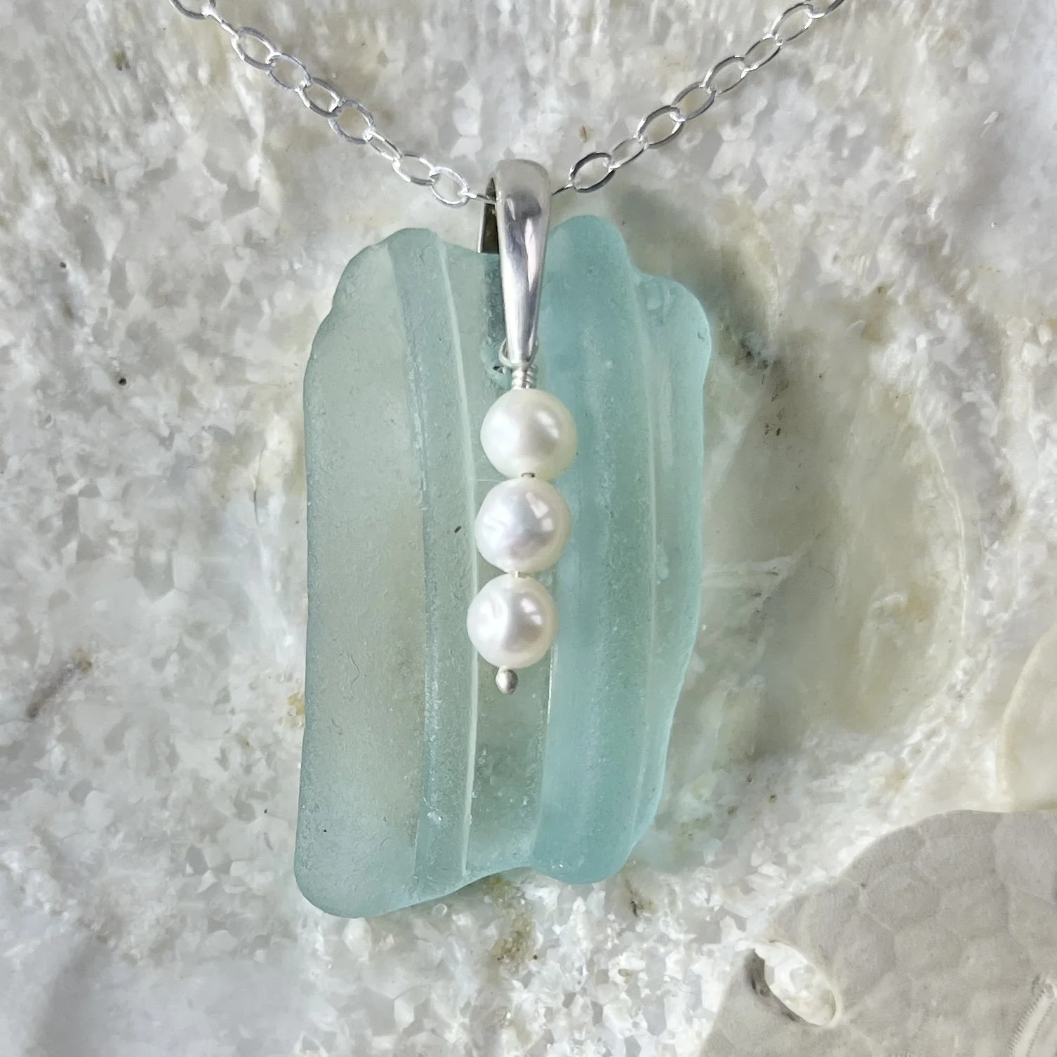Blue seafoam sea glass necklace with a trio of freshwater pearls by Janet Payne Jewelry, Cape May, NJ