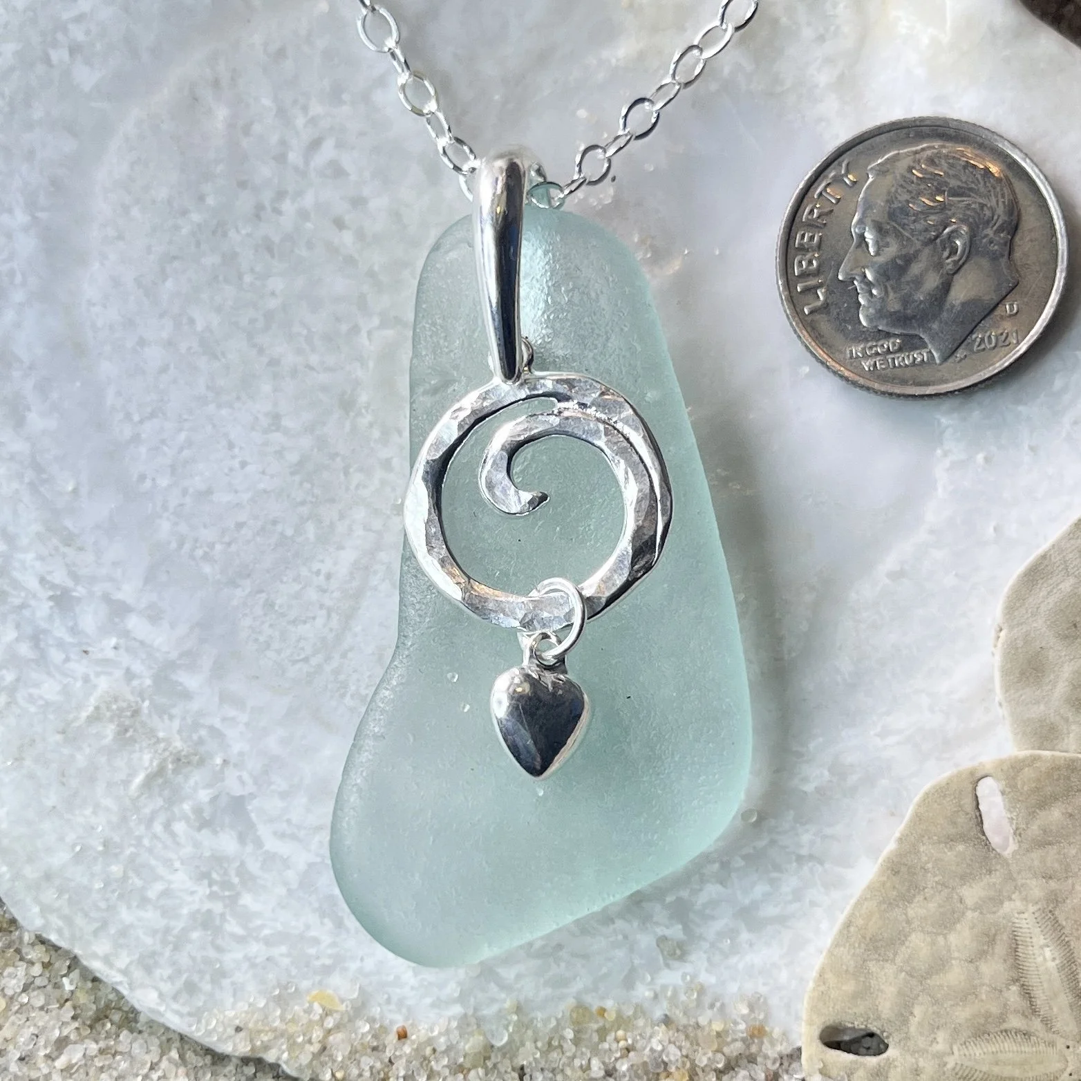 Blue Seafoam Sea Glass Necklace with a Sterling Silver Ocean Wave and Heart.jpg