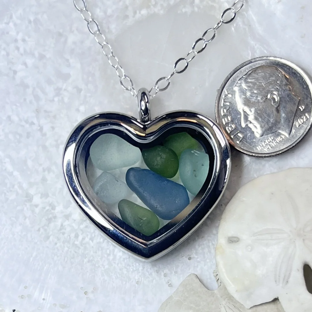 Glass Heart Locket Filled with Shades of Blue and Green Sea Glass.jpg