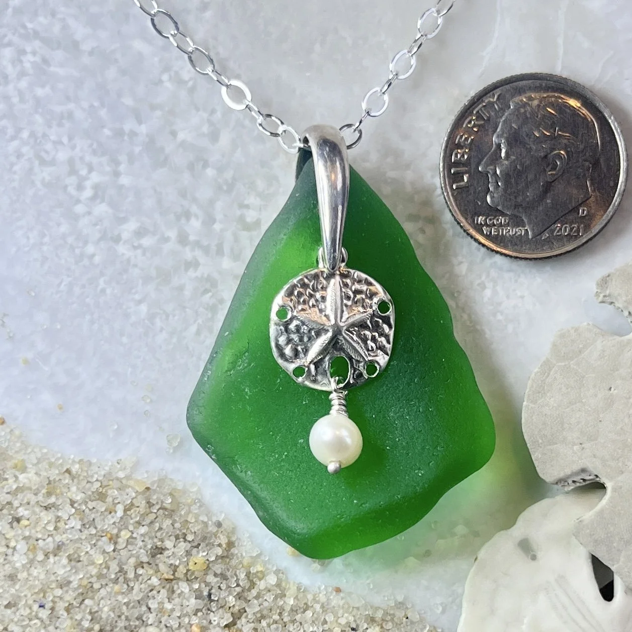 Green Sea Glass Necklace with a Sterling Silver Sand Dollar and a Freshwater Pearl.jpg