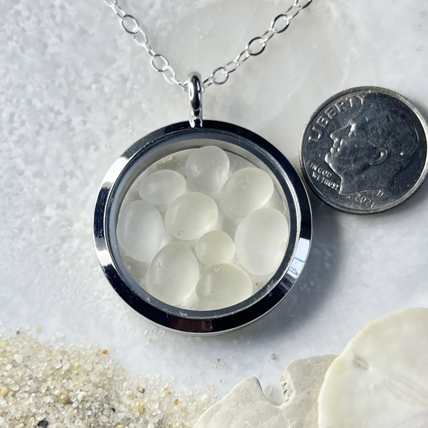 Glass Circle Locket Filled with Natural Cape May Diamonds.jpg