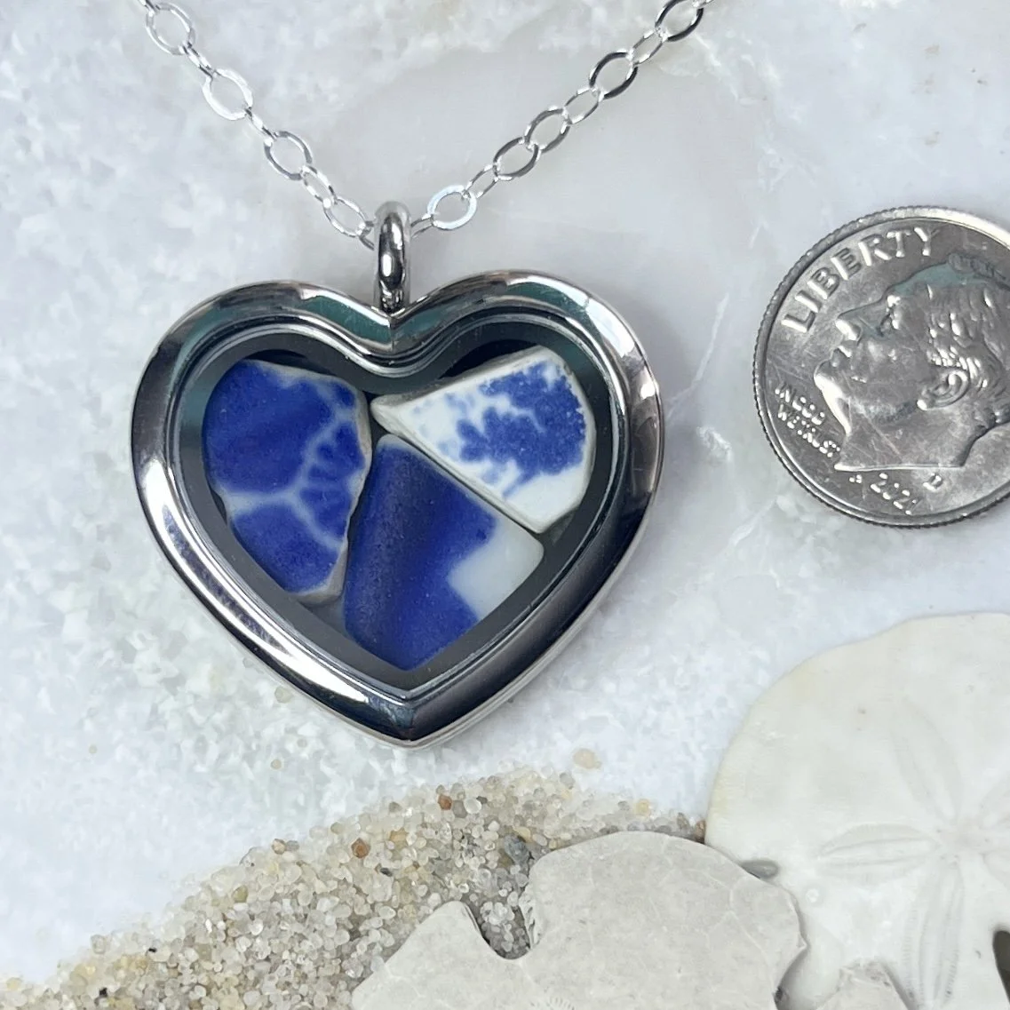 Glass Heart Locket Filled with Blue and White Sea Pottery.jpg