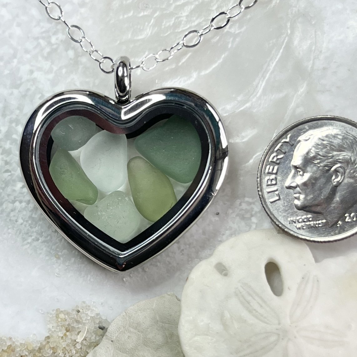 Glass Heart Locket Filled with Shades of Green Sea Glass .jpg