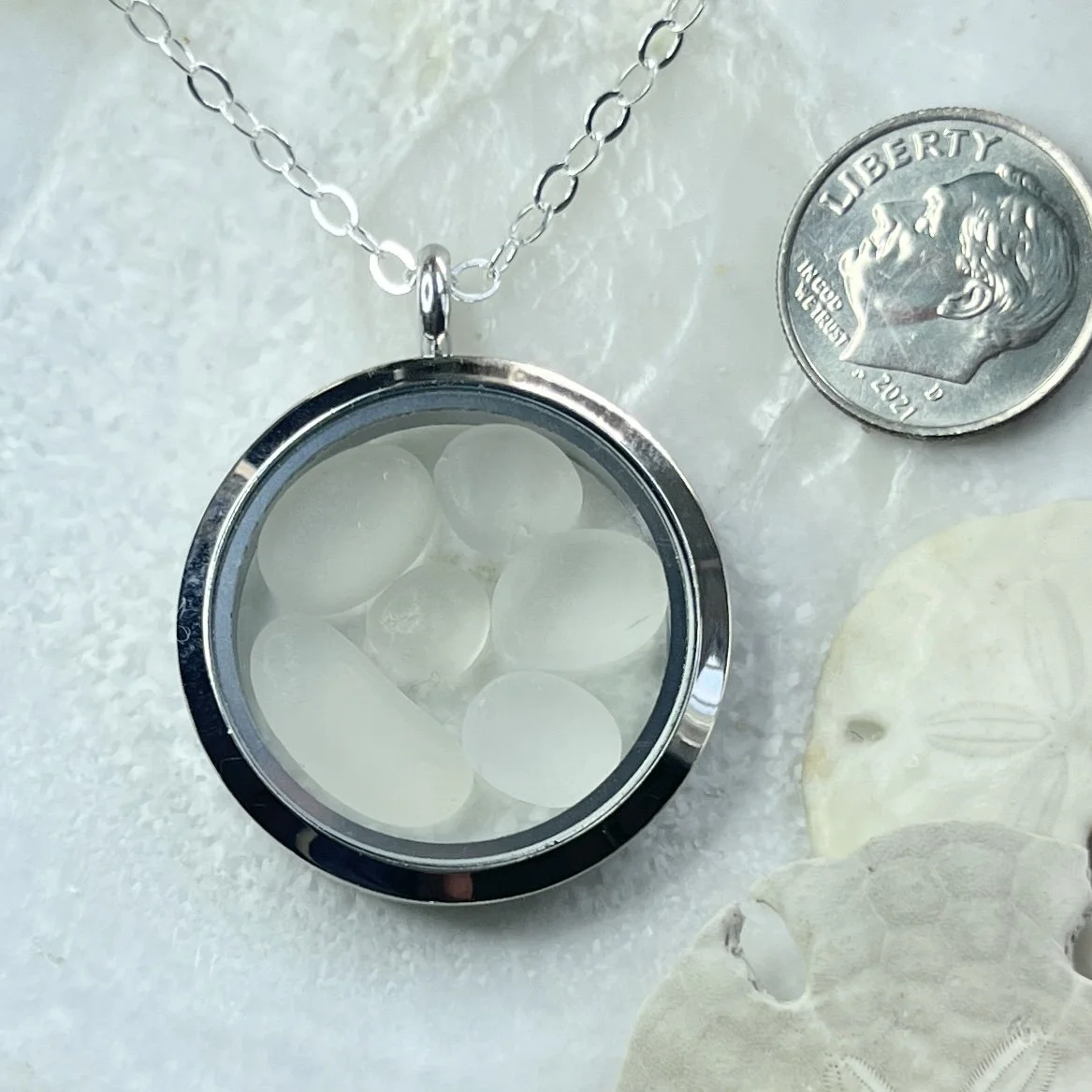 Glass Circle Locket Filled with Six Natural Cape May Diamonds.jpg