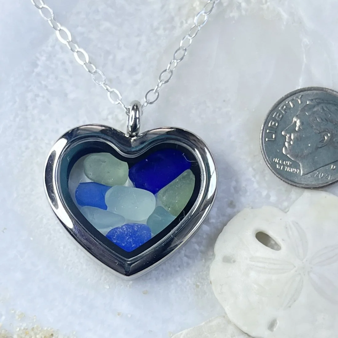 Glass Heart Locket Filled with Blue and Seafoam Sea Glass.jpg