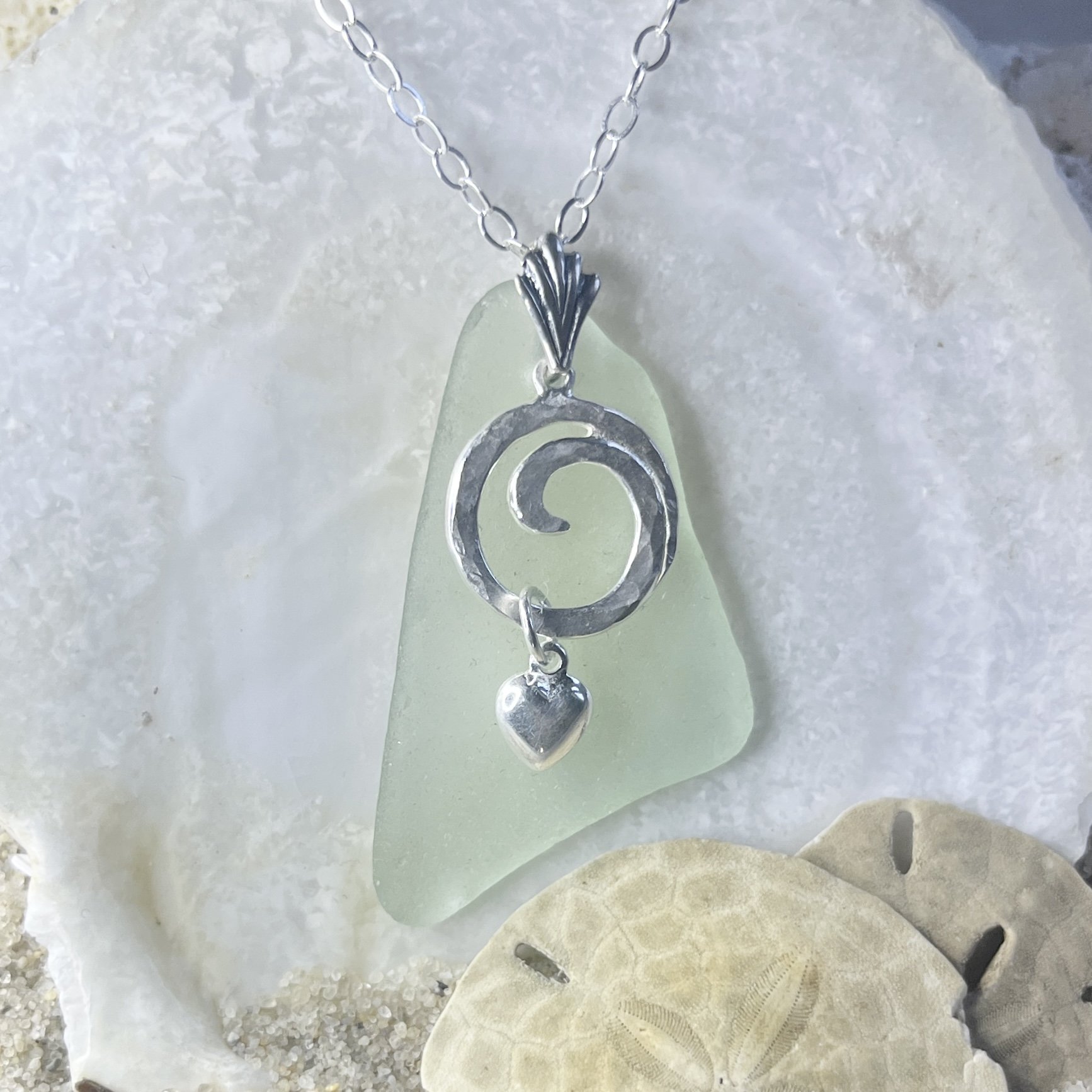 Seafoam sea glass necklace with a sterling silver ocean wave and a sterling silver heart  by Janet Payne Jewelry, Cape May, NJ
