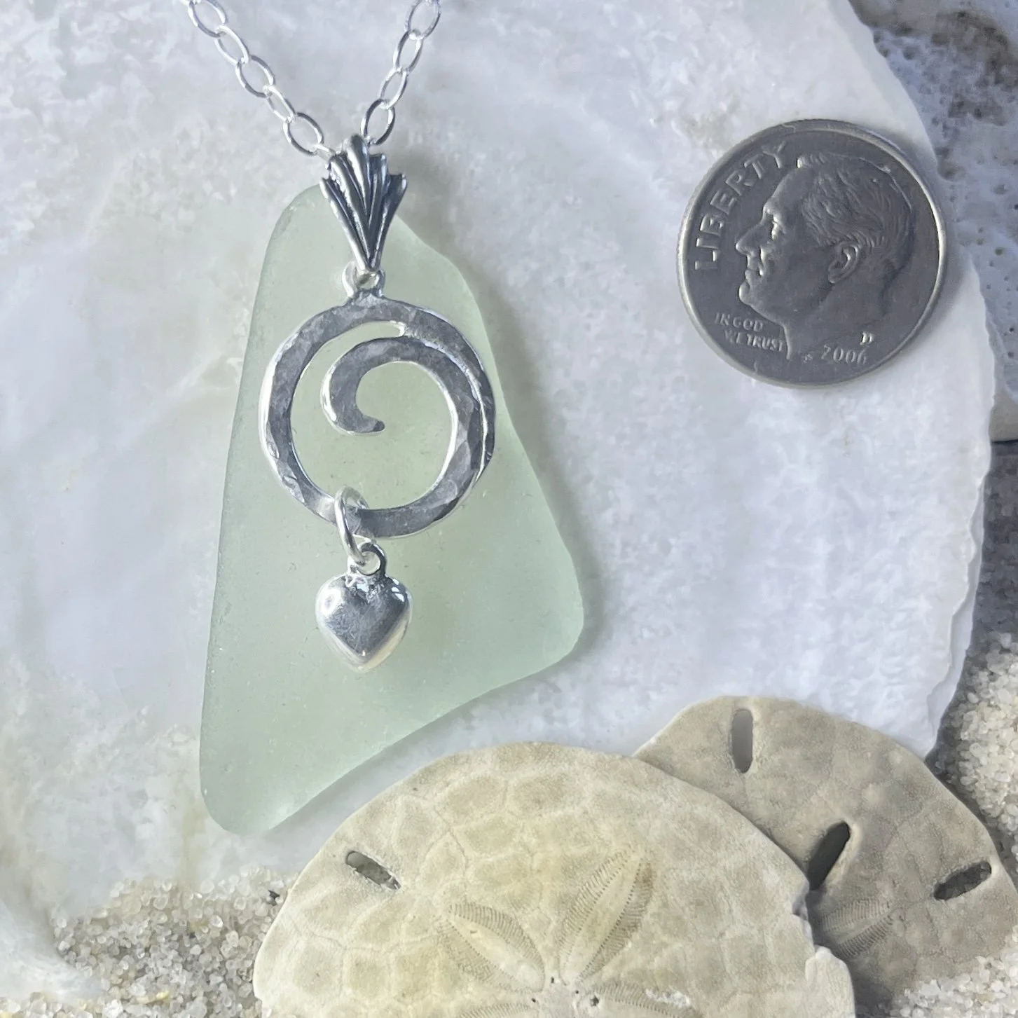 Seafoam sea glass necklace with a sterling silver ocean wave and a sterling silver heart by Janet Payne Jewelry, Cape May, NJ