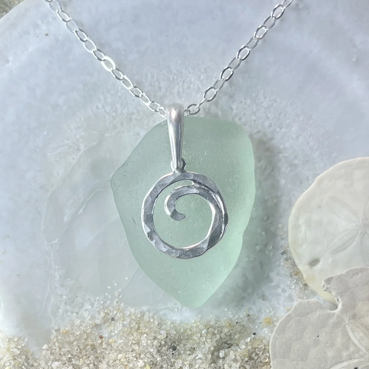 Seafoam sea glass necklace with a sterling silver ocean wave  by Janet Payne jewelry, Cape May, NJ