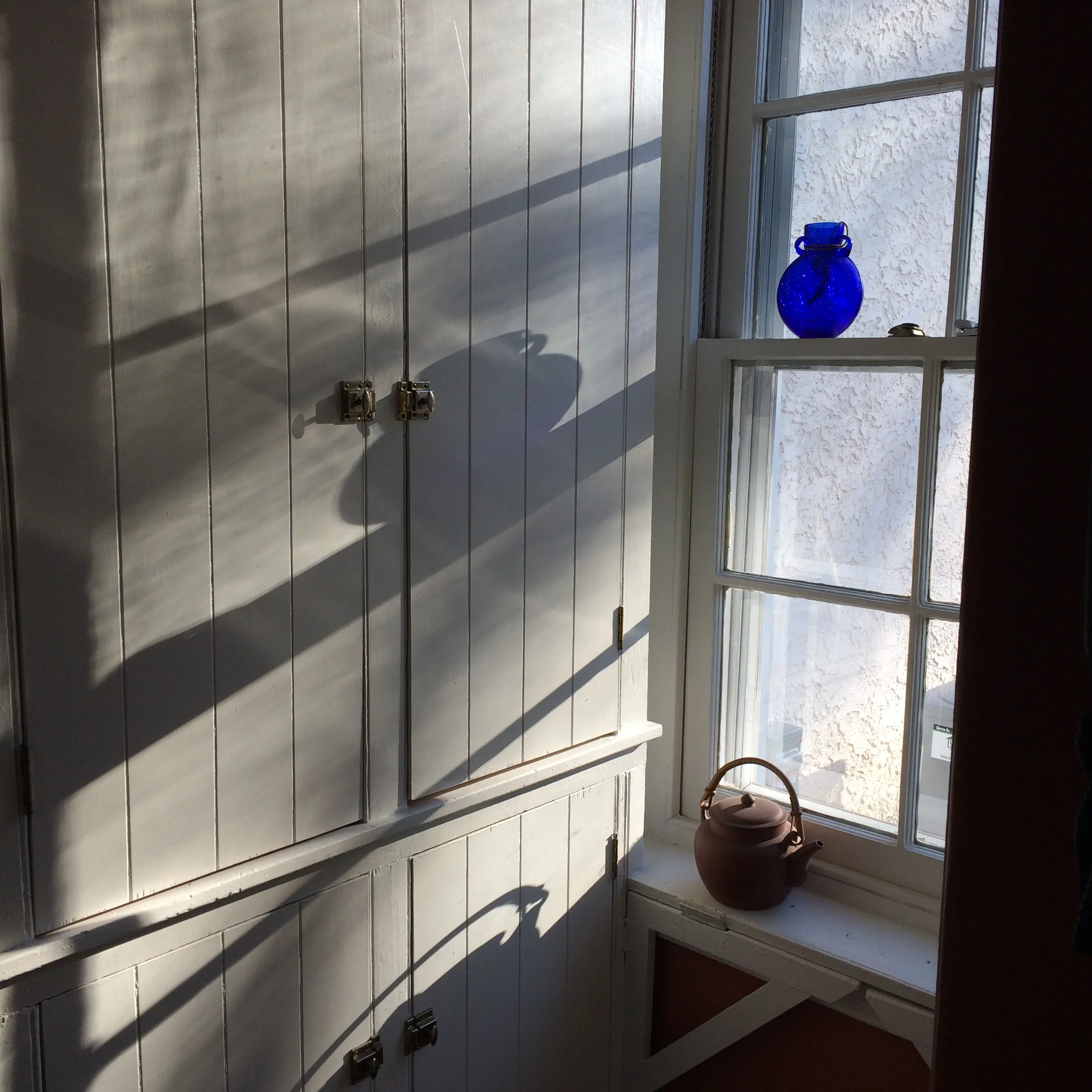 Late Winter light on pantry doors