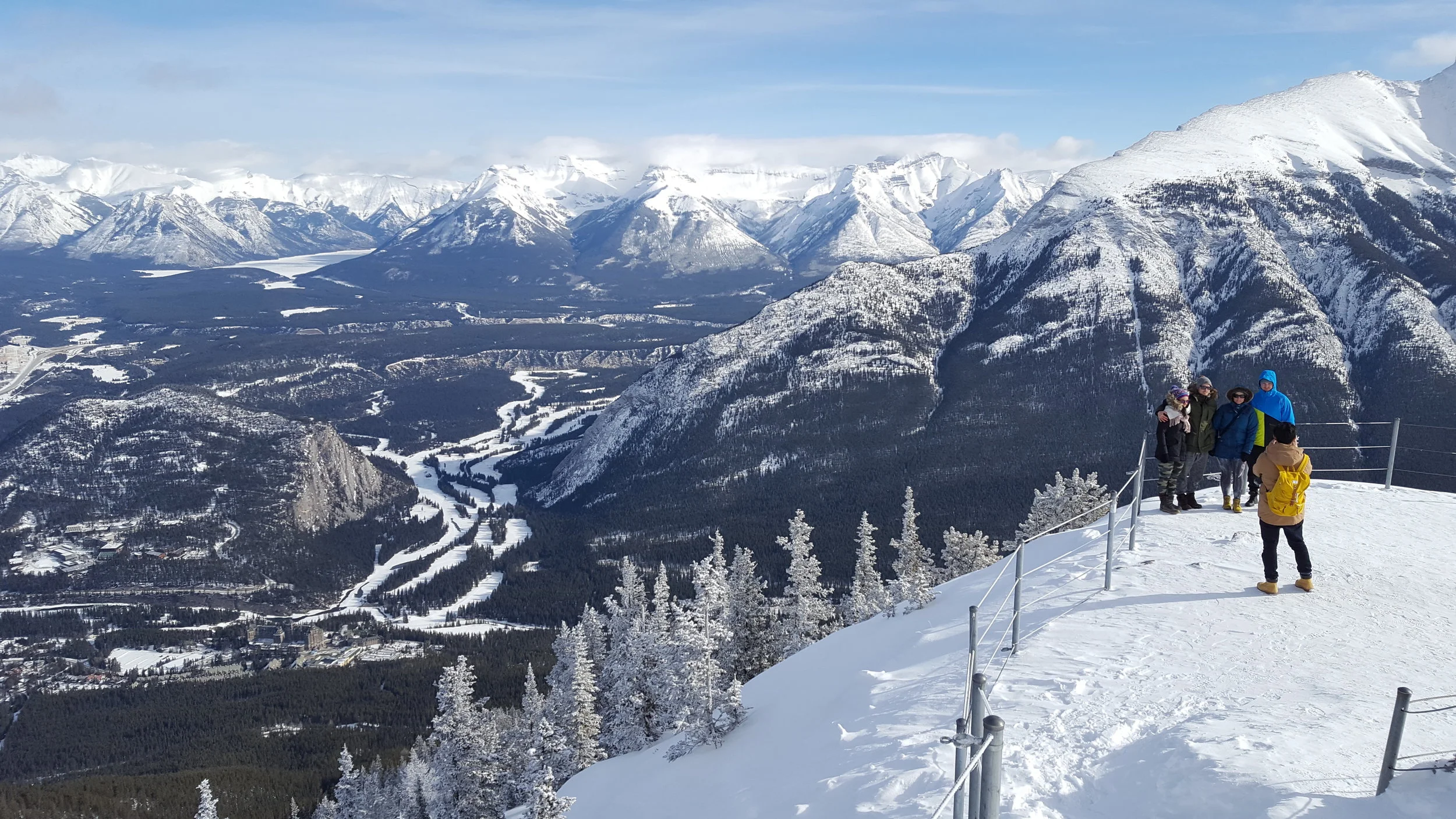 Jared taking a photo of some tourists at the top of Sulphur Mountain. It was so cold up there that our hair was freezing. in the valley you can just see the Banff Centre nestled into Buffalo Mountain.