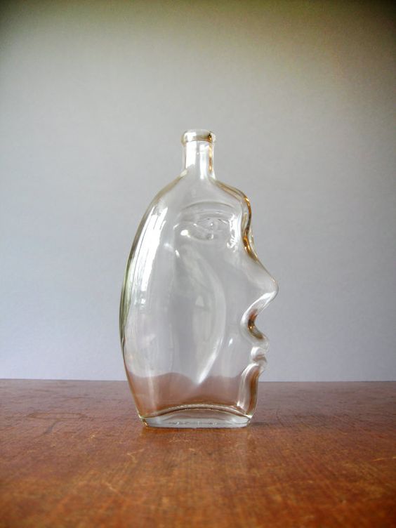 An Etsy find: glass jar with face
