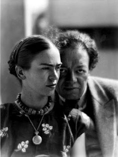 Frida Kahlo wearing a locket; pictured with Diego Rivera, photo by Martin Munkacsi, 1930.