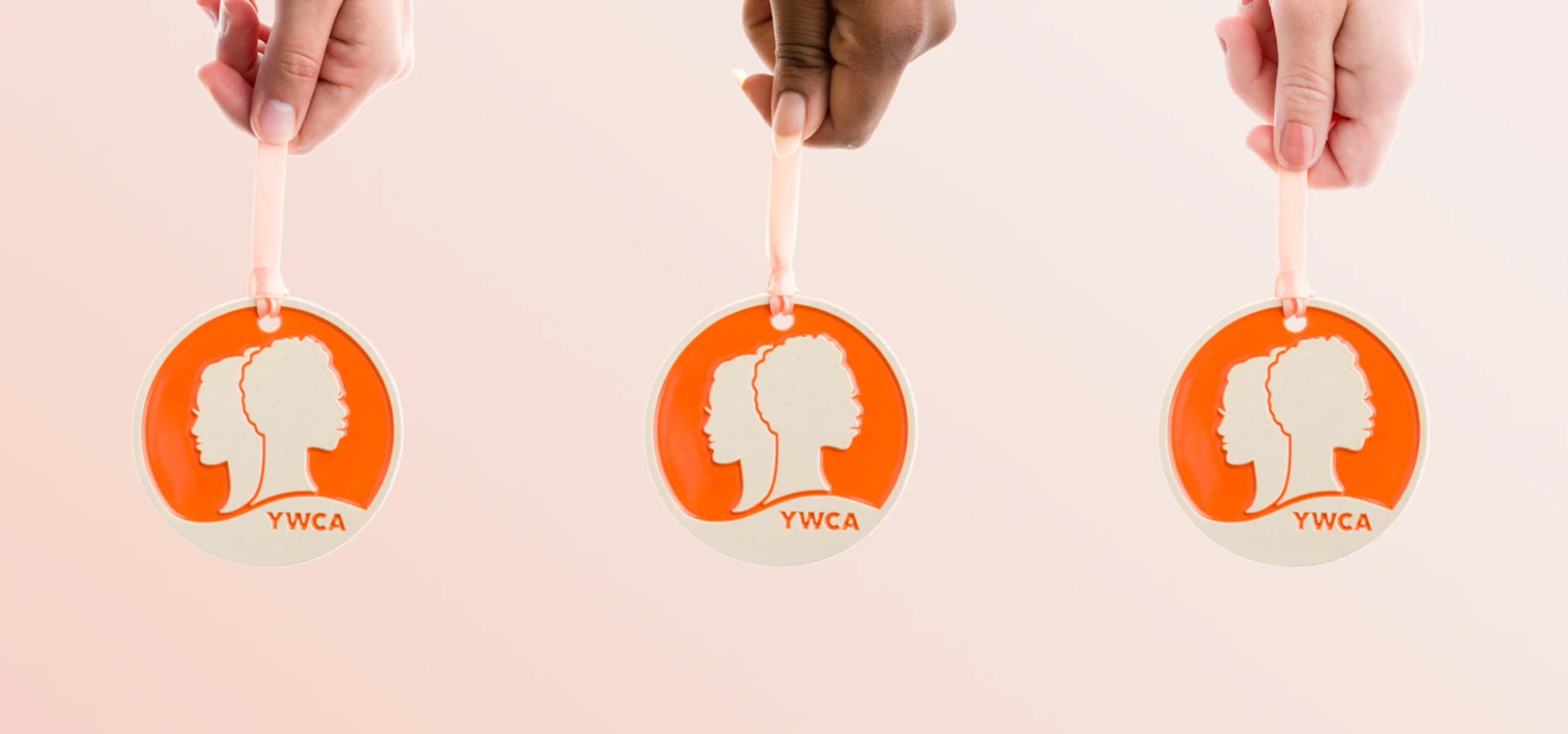 YWCA_Hands_With_Ornaments_Aug_2018_3_Banner.jpg