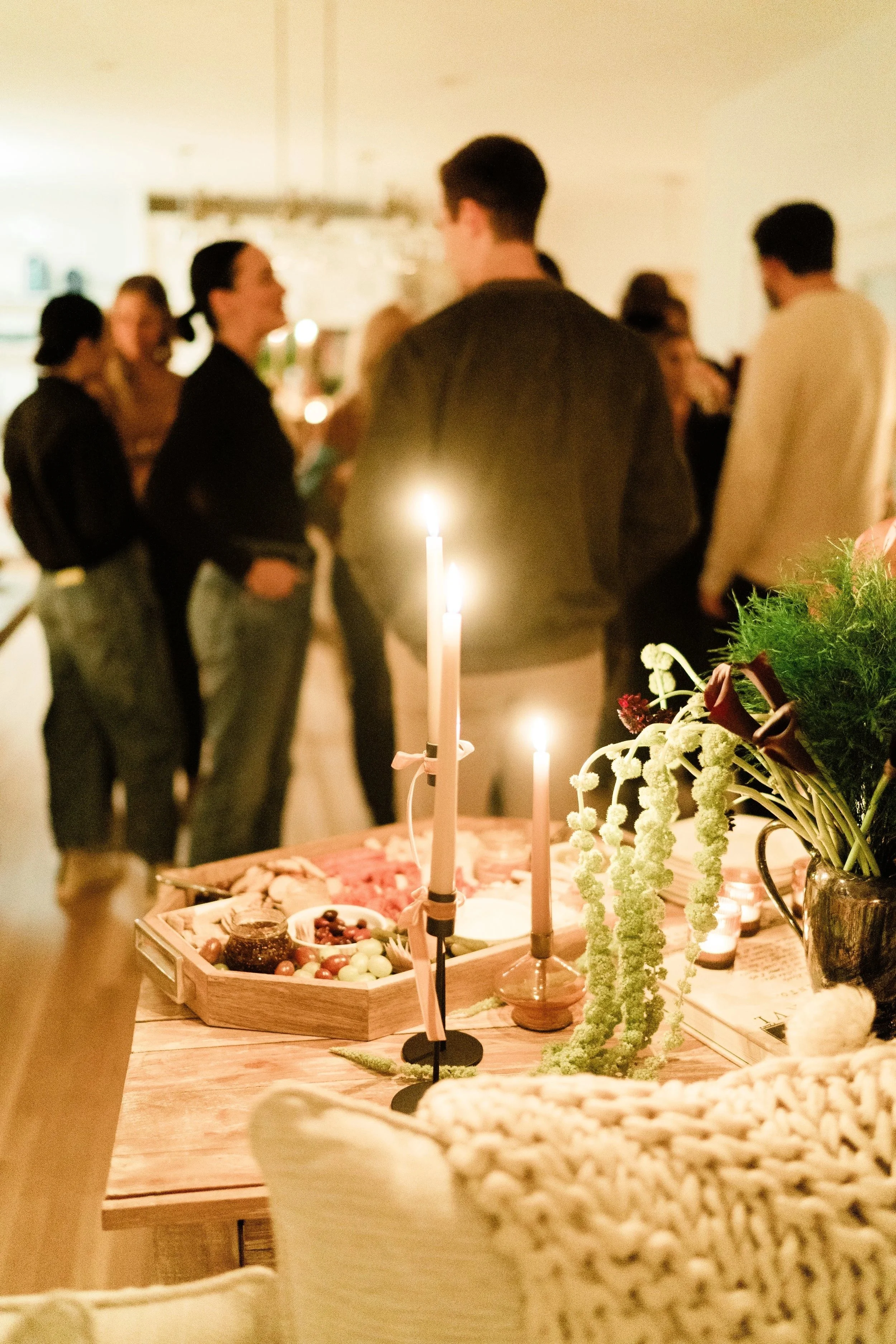 Guests gathered at candlelit food and wine community event photography Charleston SC