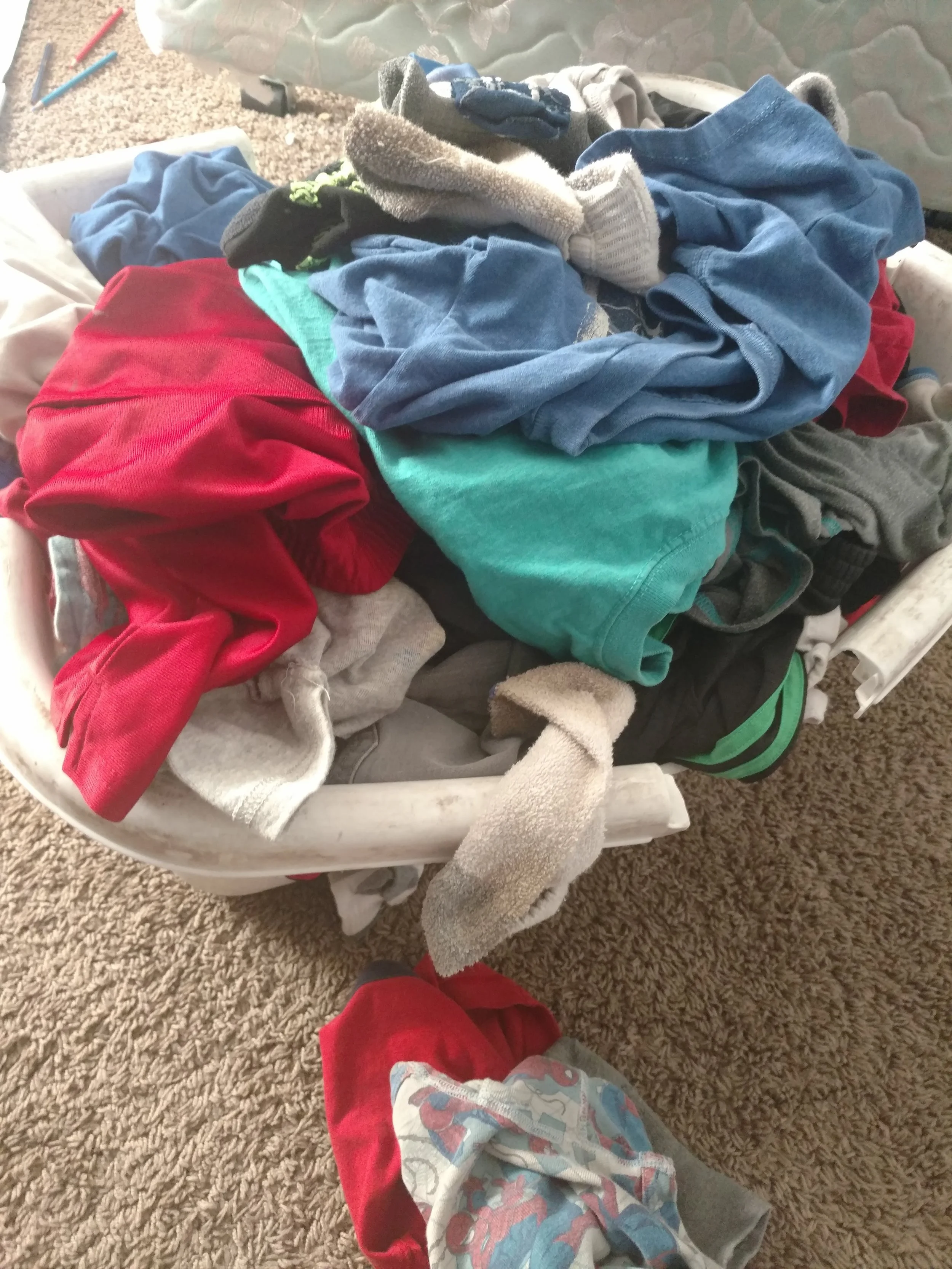 Here is a basket of clean clothes from my little boys. I laughed when I looked at the shape of my laundry basket. Apparently, I need to get some new ones because these are 17 years old and completely falling apart. 