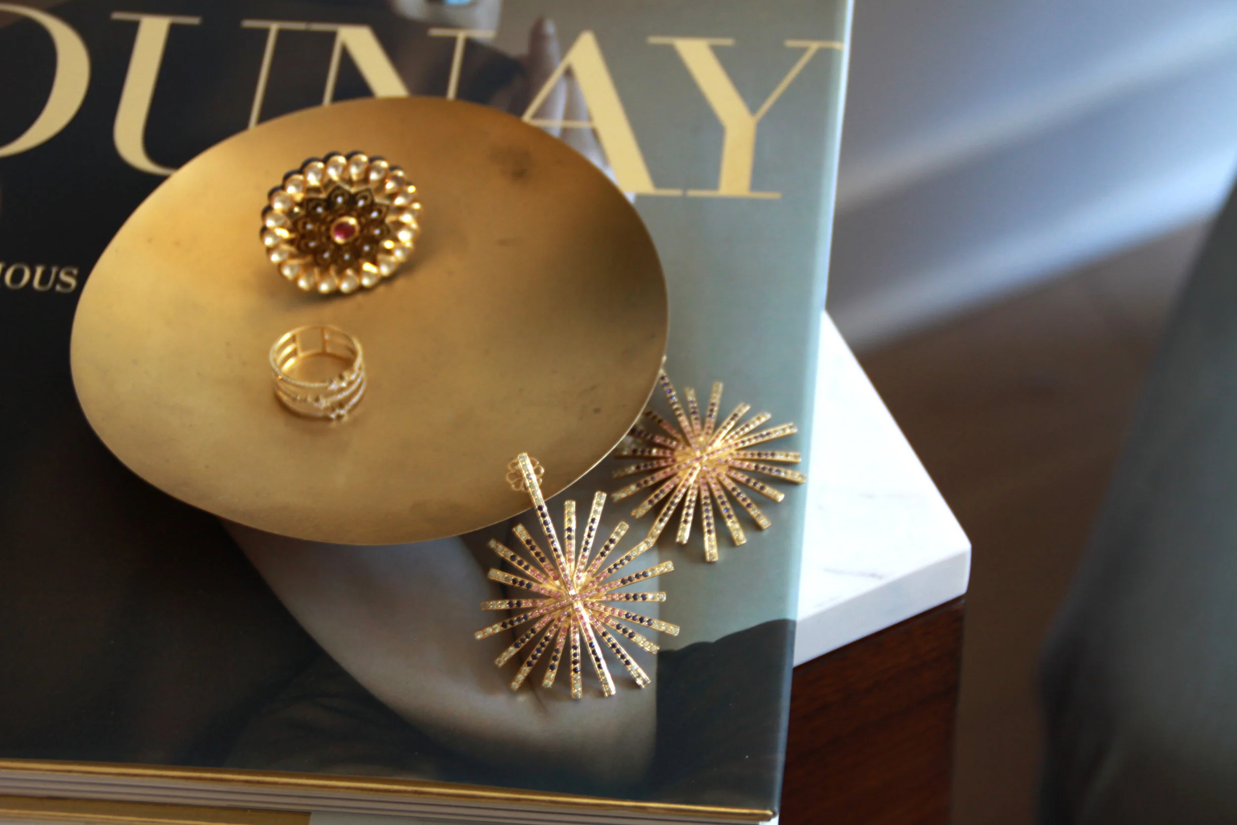 Starburst earrings, inspired by the Jaipur nightfall. Hand-crafted in 14-karat yellow gold and studded in round sapphires and tourmalines