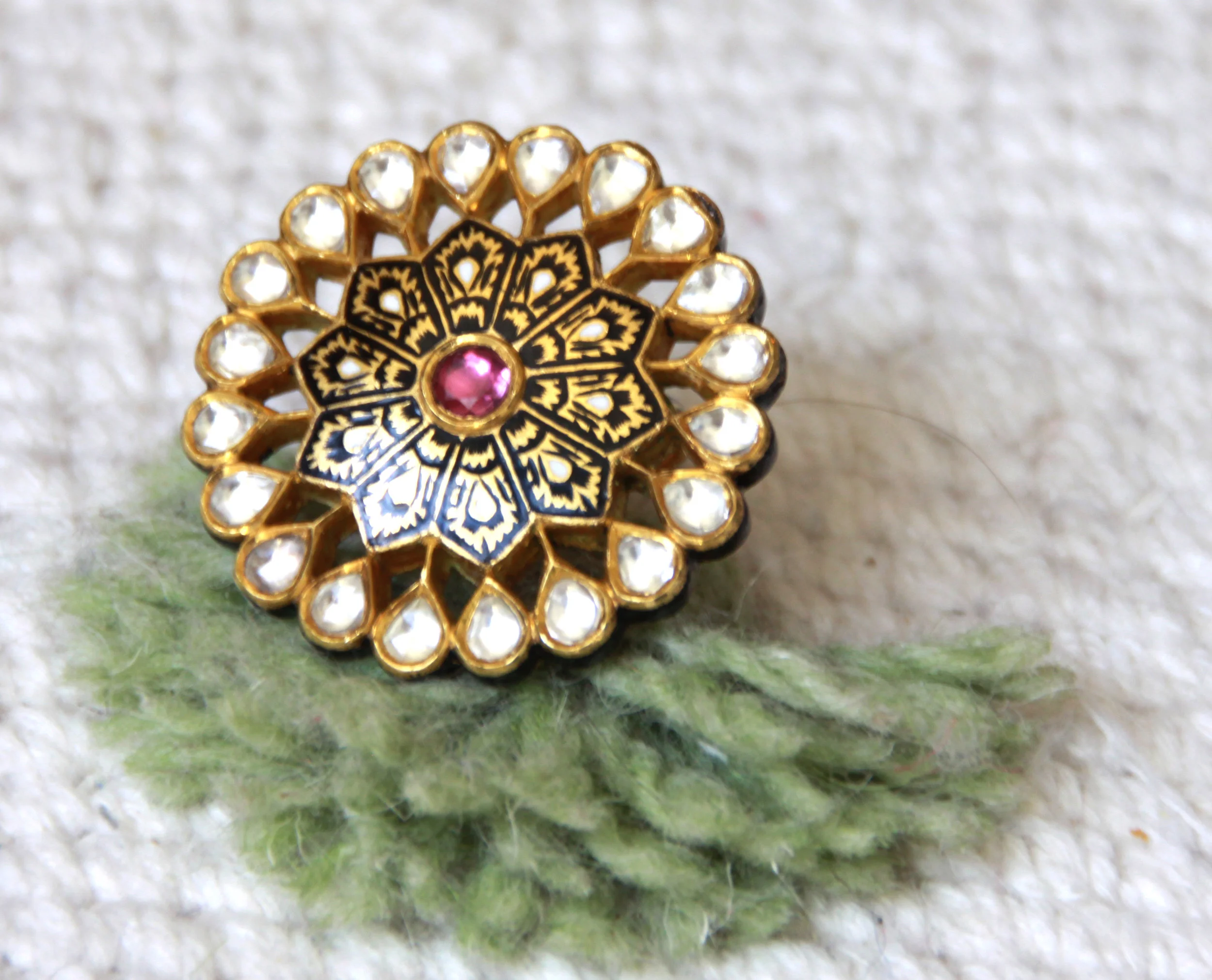 Diamond Flower Power, signature black and gold hand-enameled ring with floral motifs, rose cut diamonds and rhodolite gemstones.