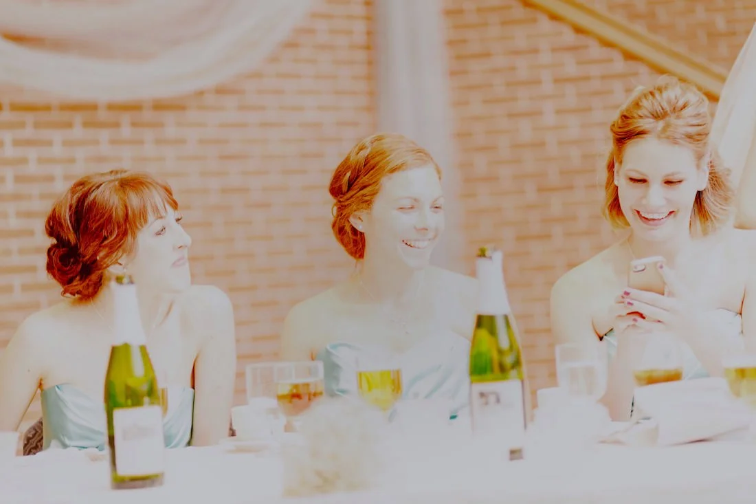 Edited JPG. The photo was so overexposed that there was no detail in the highlights to recover in editing. Note all of the girls hair is much more red