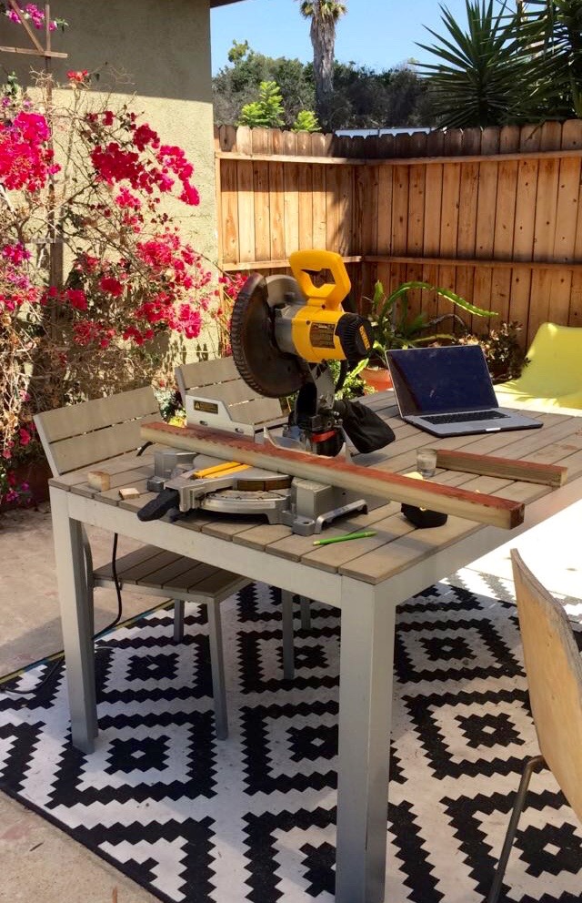 Cutting pieces of the subfloor framing in my makeshift backyard woodshop