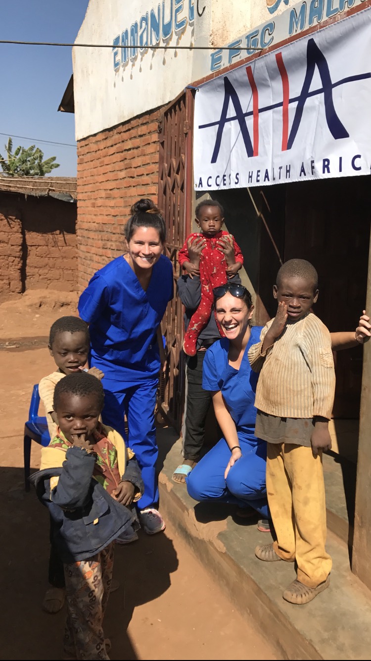 AHA Dental team Kristen (L) and Dr. Jenn Mullarkey (R) visit Dzaleka Refugee Camp in Dowa, Malawi 