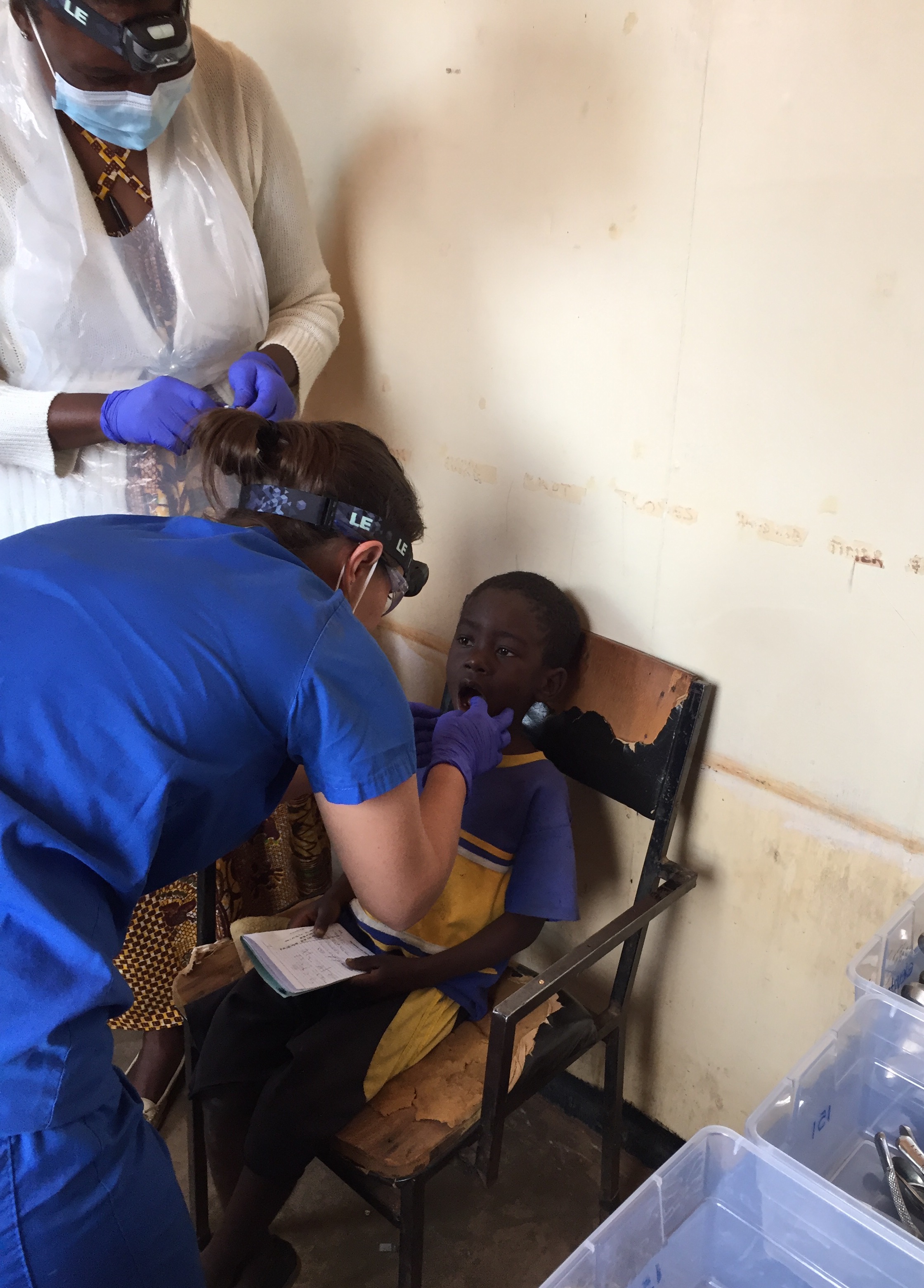 Dr. Jenn Mullarkey treats a patient at Dzaleka Refugee Camp on July 20, 2017