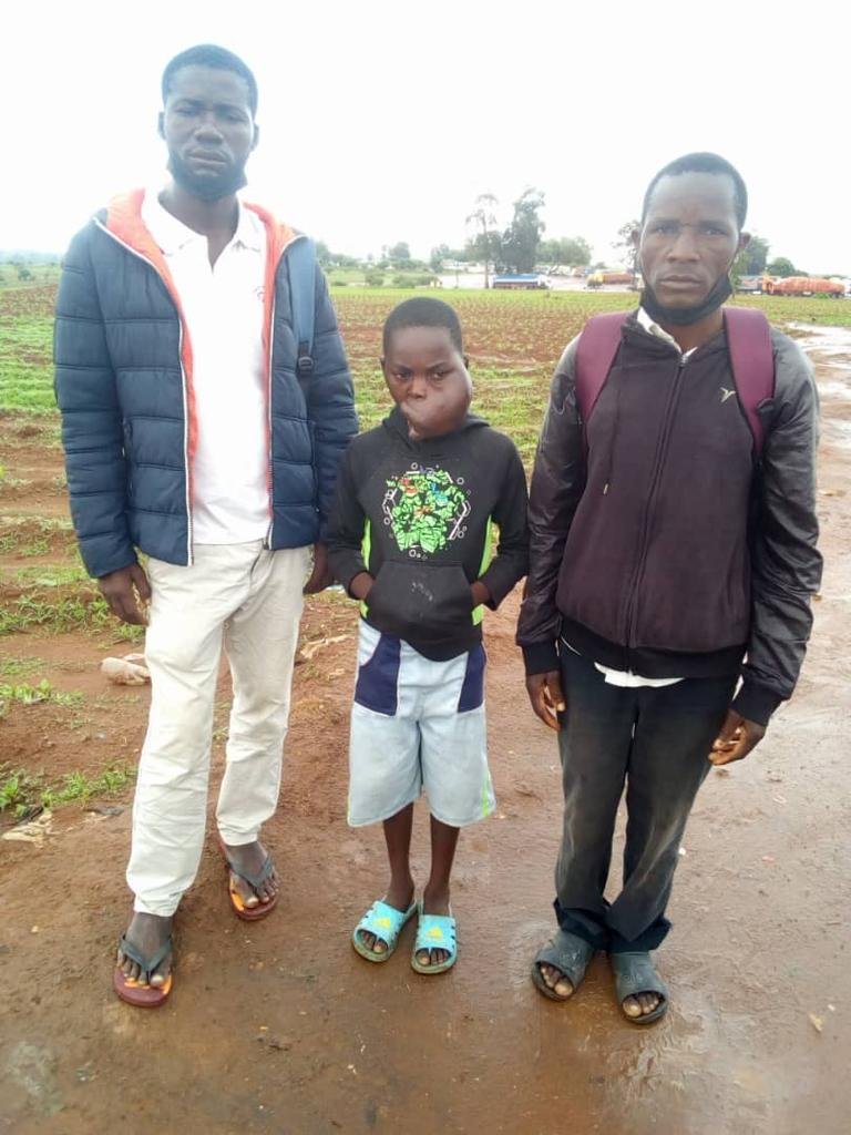 Helder, Mphatso, and Alick meet at the Mozambique-Malawi border