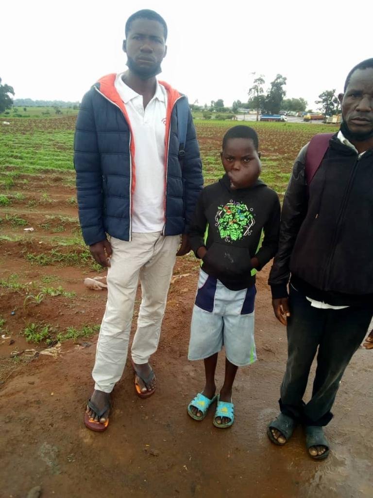 Helder, Mphatso, and Alick at the Mozambique-Malawi border