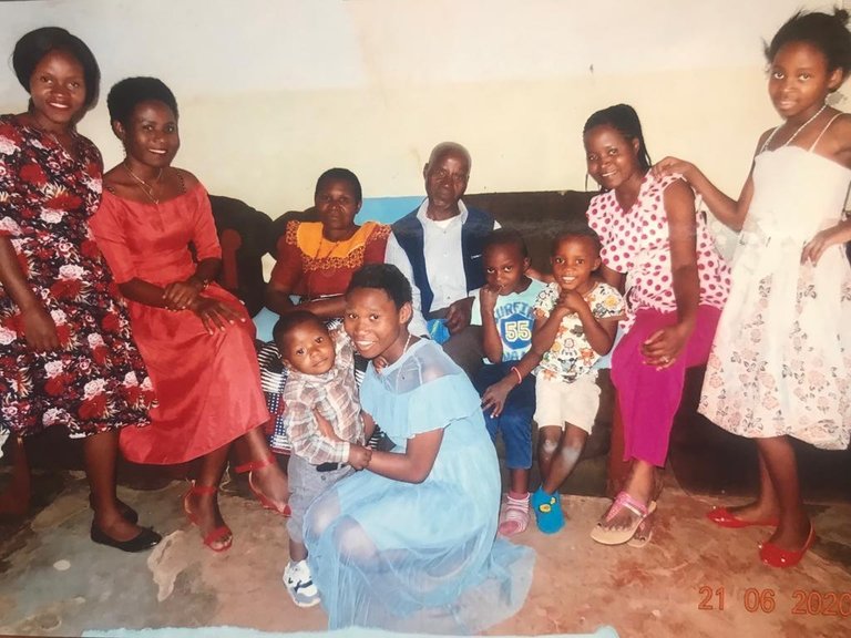  John with his wife Monica, five of his daughters, and several of his grandchildren. 