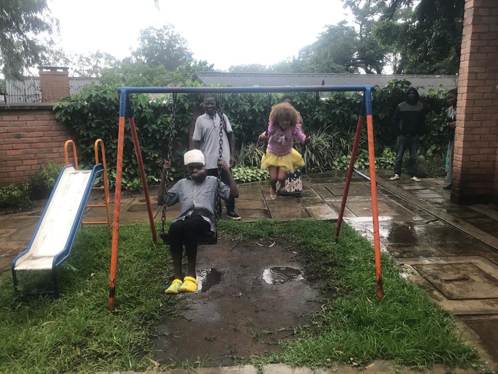 Mphatso &amp; Ziona enjoy the swings