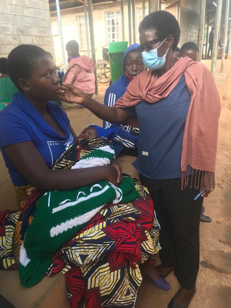 Christina counsels a keloid patient referred to AHA from another program.