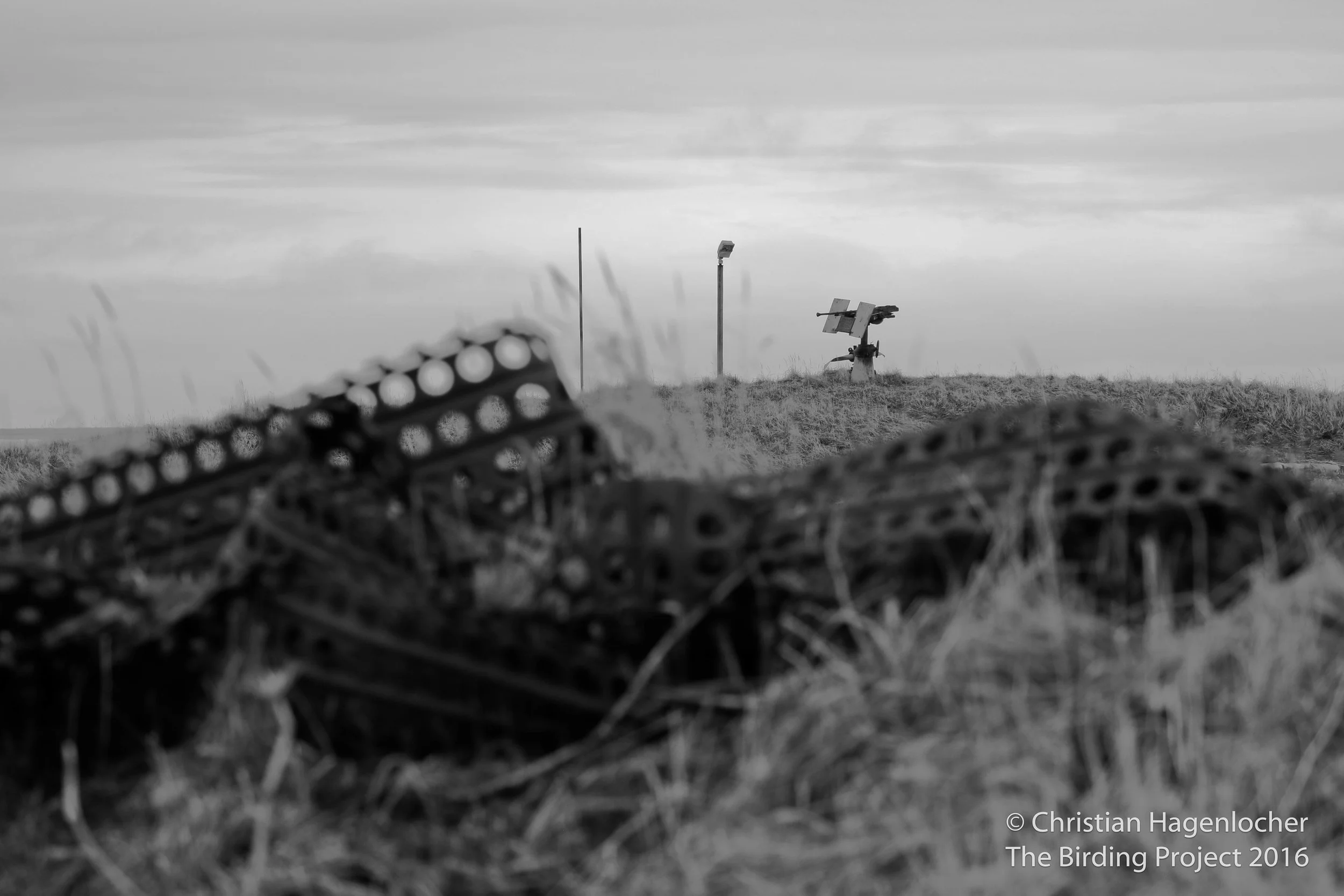 A .50 caliber machine gun stands as a reminder of the bloodshed on Attu during WWII