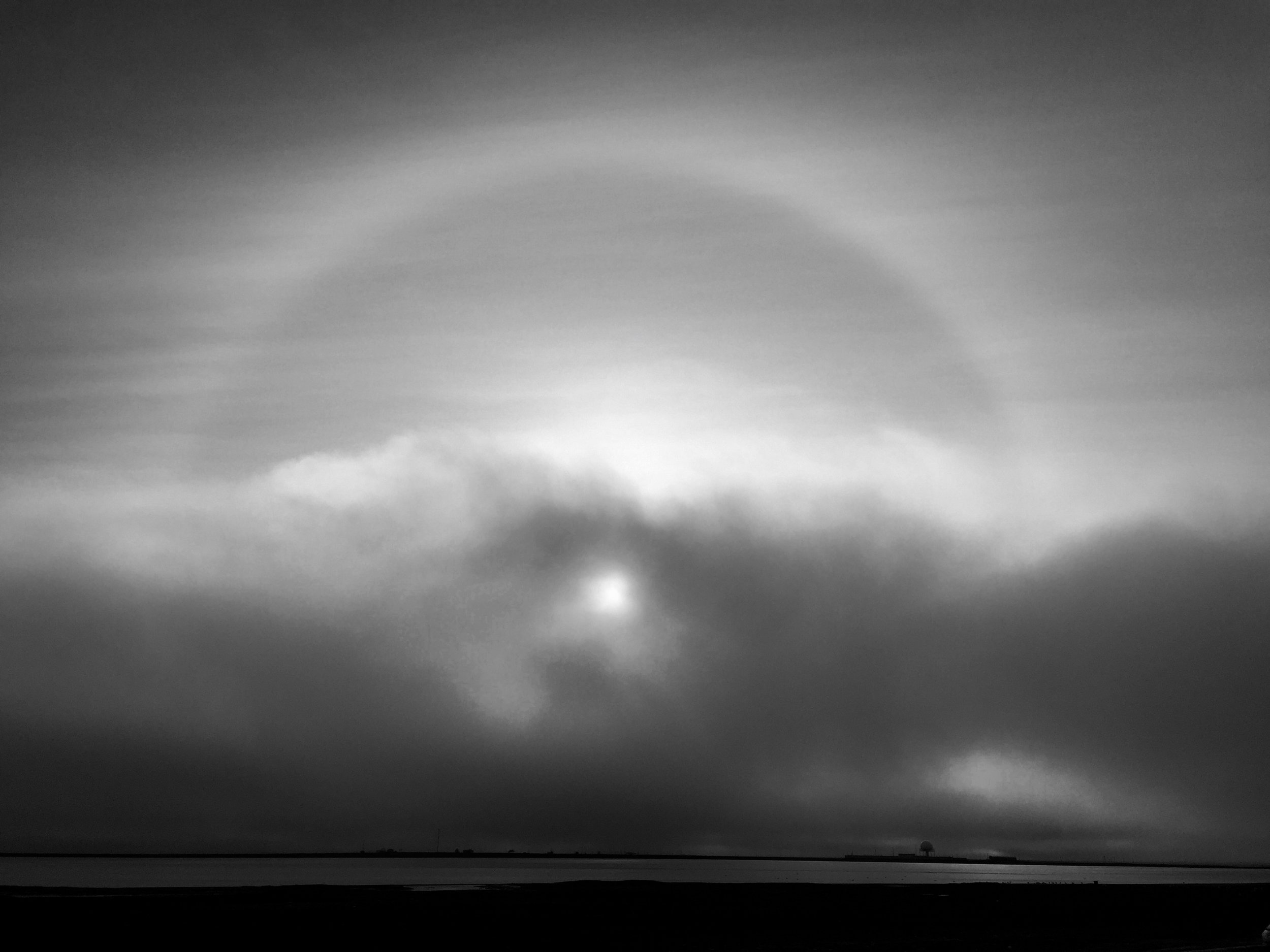 Sun halos form when sunlight passing through ice crystals in cirrus clouds in Earth's atmosphere 