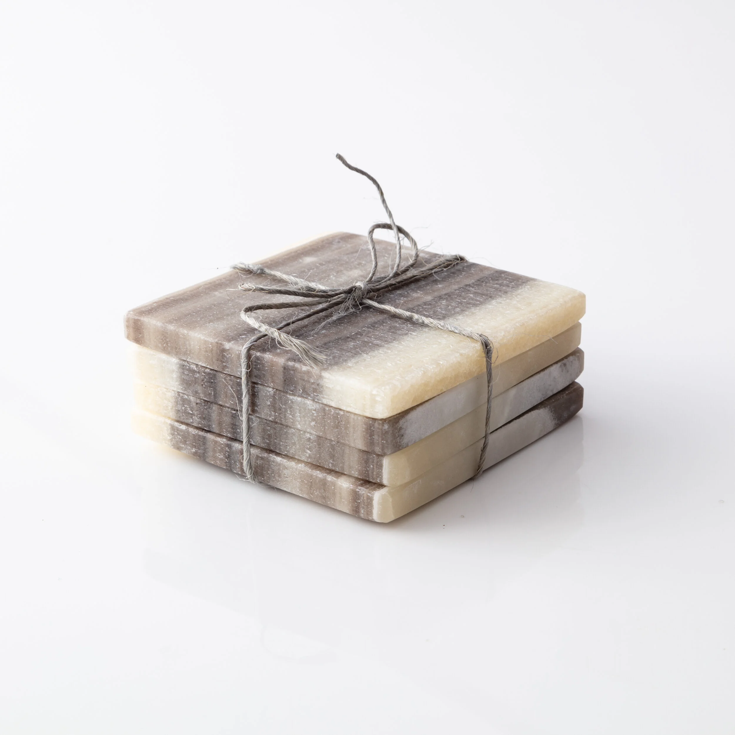 The Cristalline_Zebra Onyx Coasters Dark .jpg