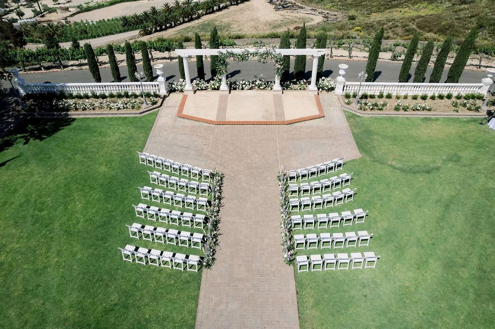Outdoor wedding ceremony at Mount Palomar Winery surrounded by vineyards in Temecula
