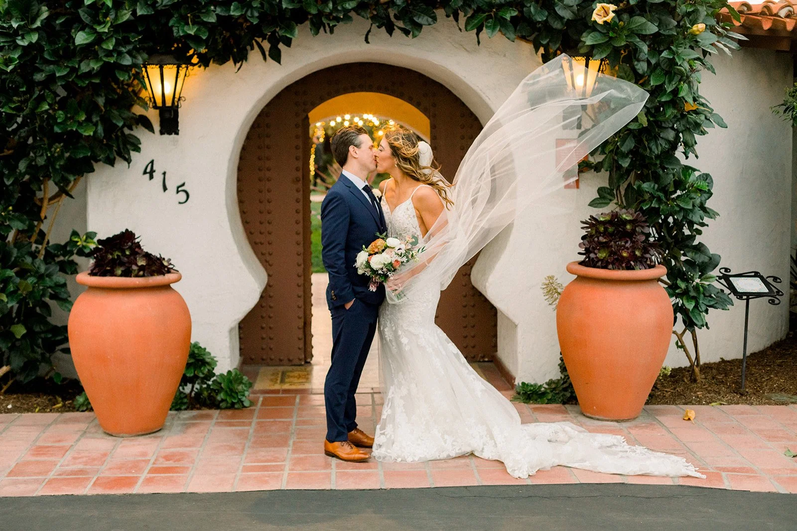 Bride and groom under Casa Romantica arch