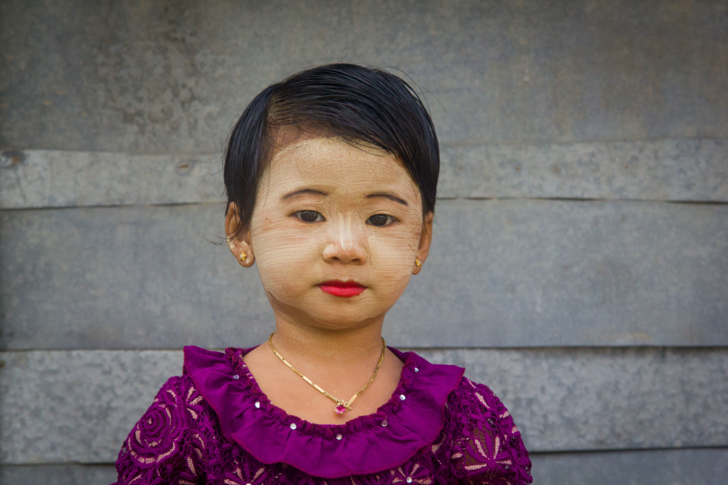 A Kalewa girl wearing a face of 'thanaka', a paste made from ground bark used as a protective measure, but which is often applied decoratively. 