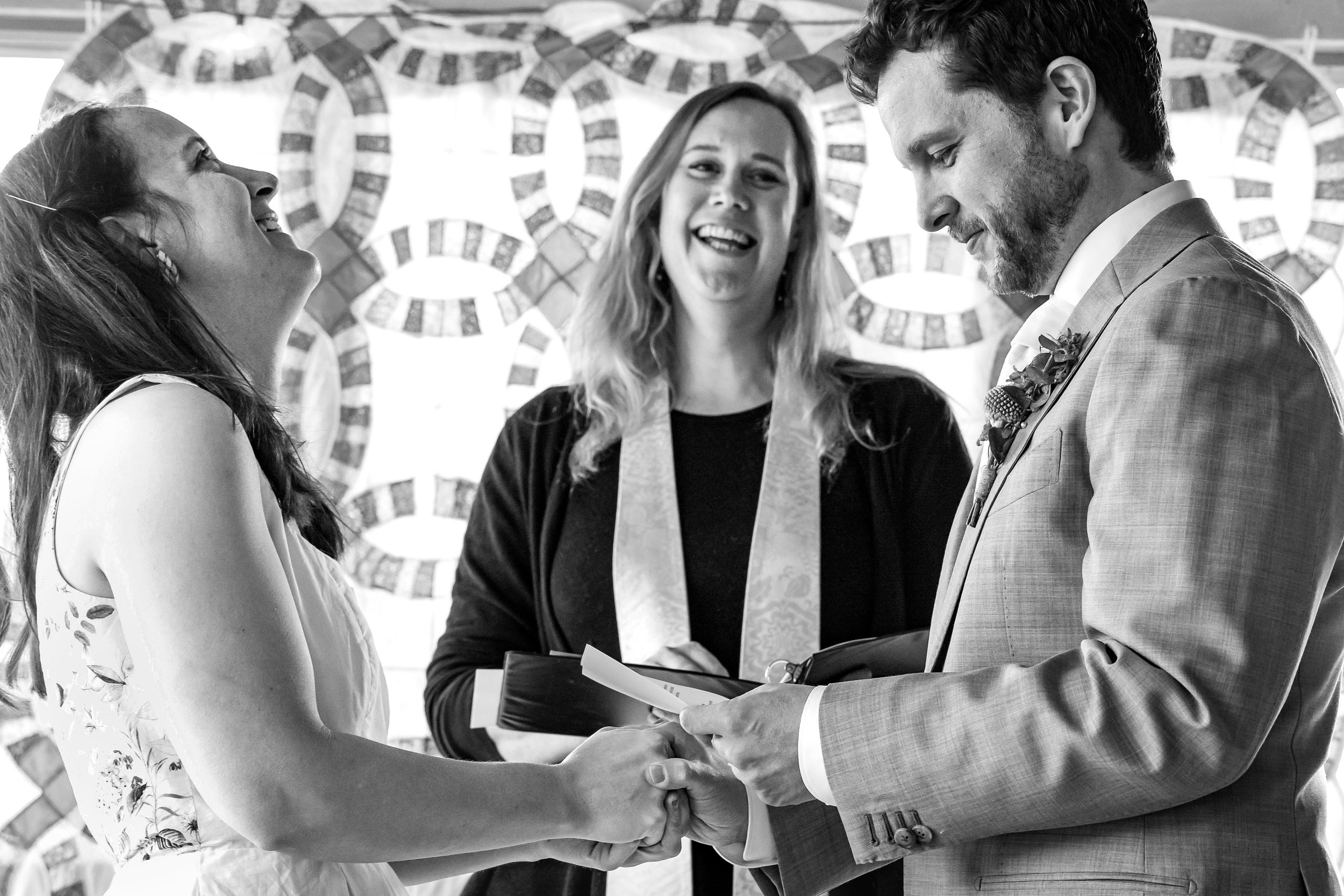 Couple laughing at the altar