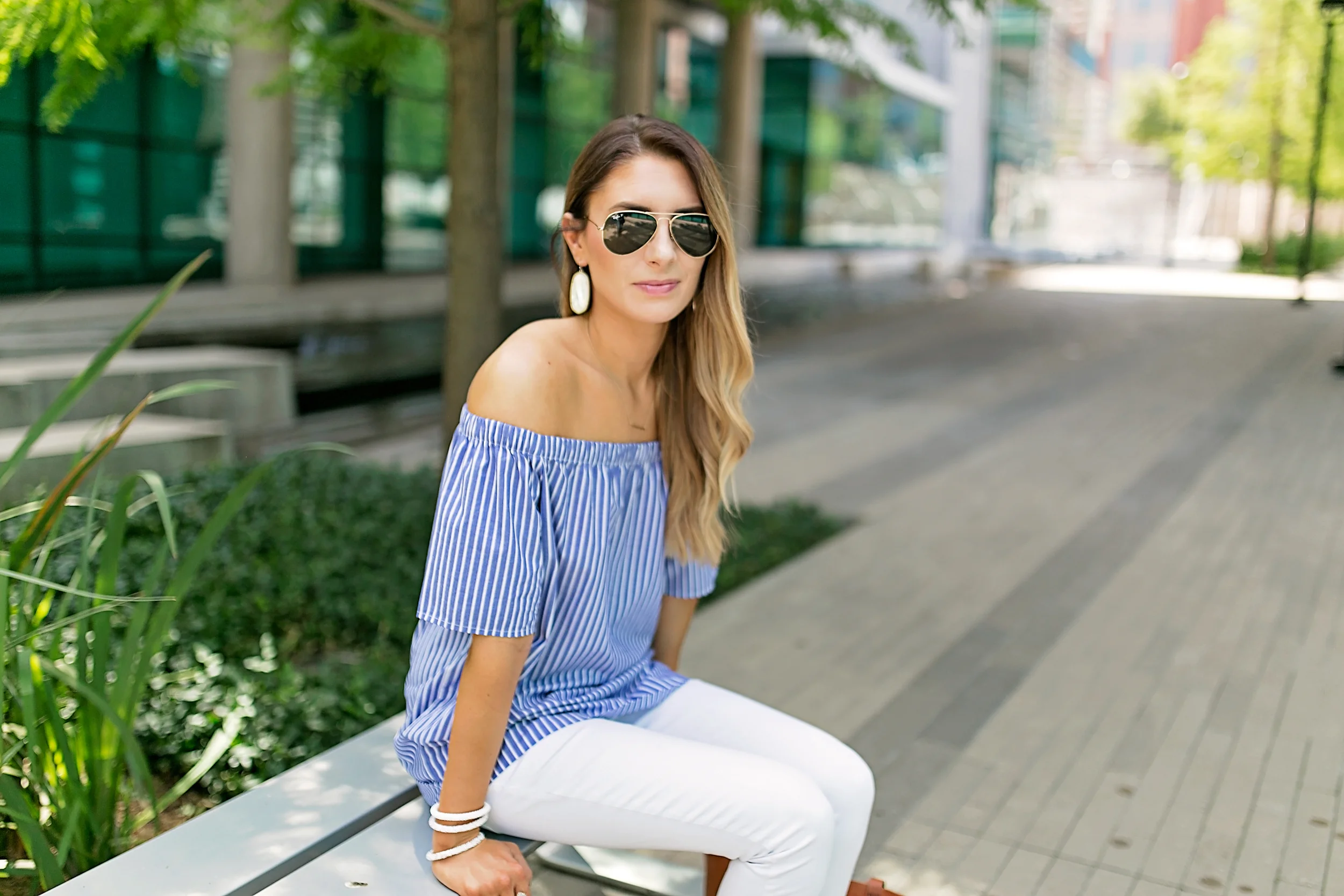 PHOTO CREDIT: Angie Garcia Shirt: Banana Republic Sunglasses: Ray Ban Pants: Gap Bag: Madewell Watch: Michael Kors Bracelets: Lily and Laura Earrings: Kendra Scott Ring: Kendra Scott Shoes: Steve Madden