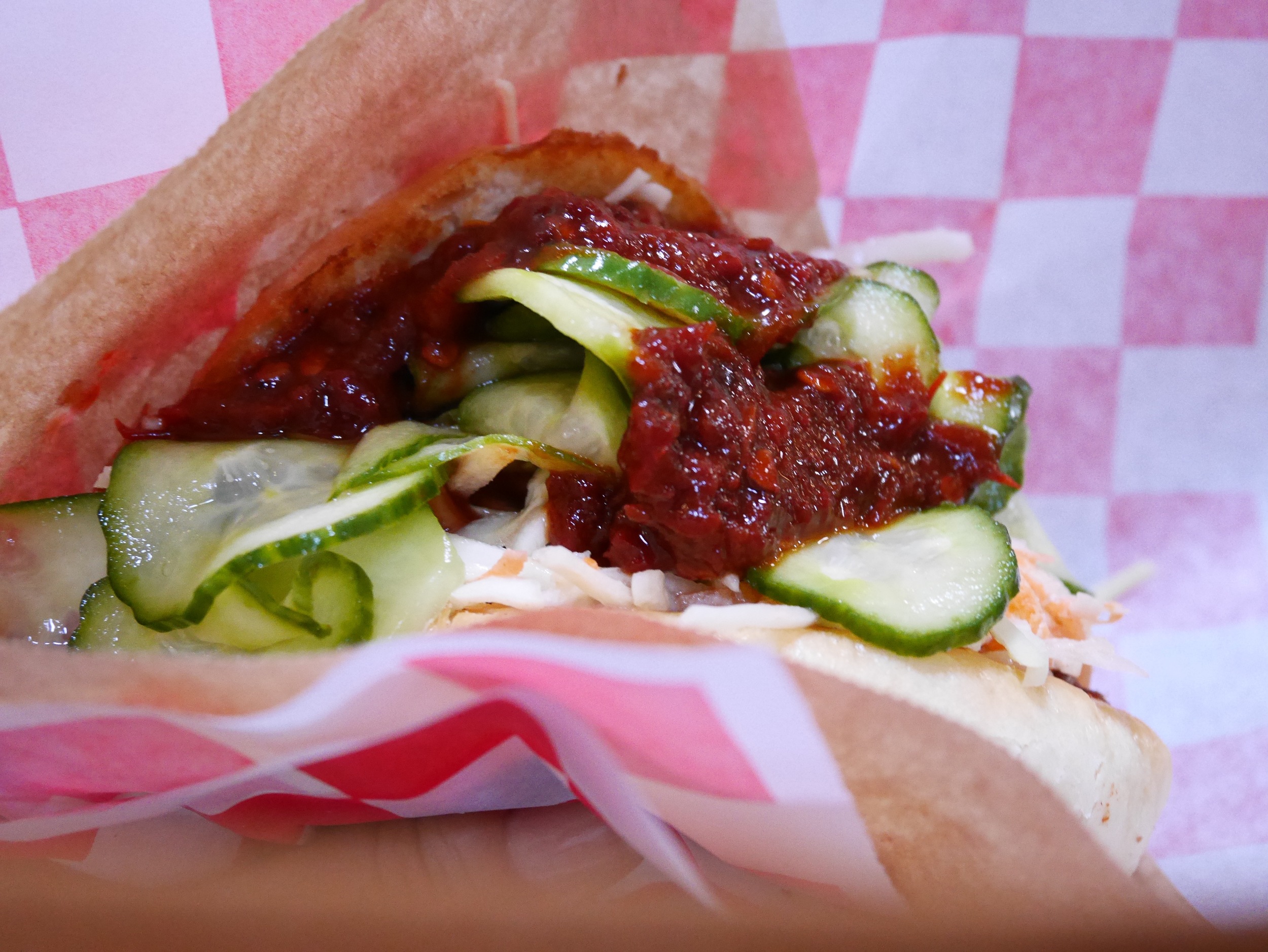 pulled pork sandwich with homemade coleslaw and pickles 