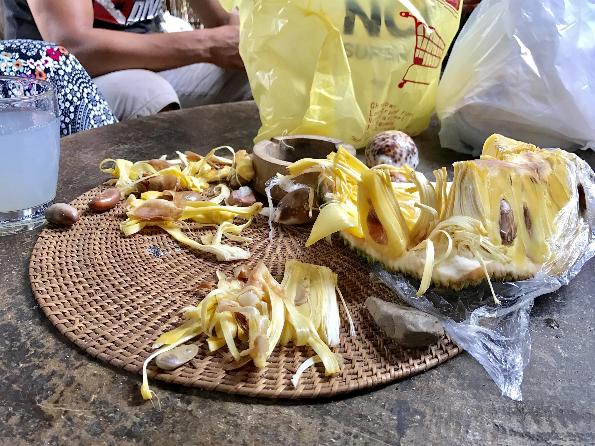 A glass of tuba and some jack fruit