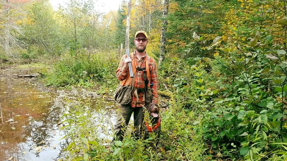 Justin and Stonyridge Octavius (Gus) taking a break by a beaver pond