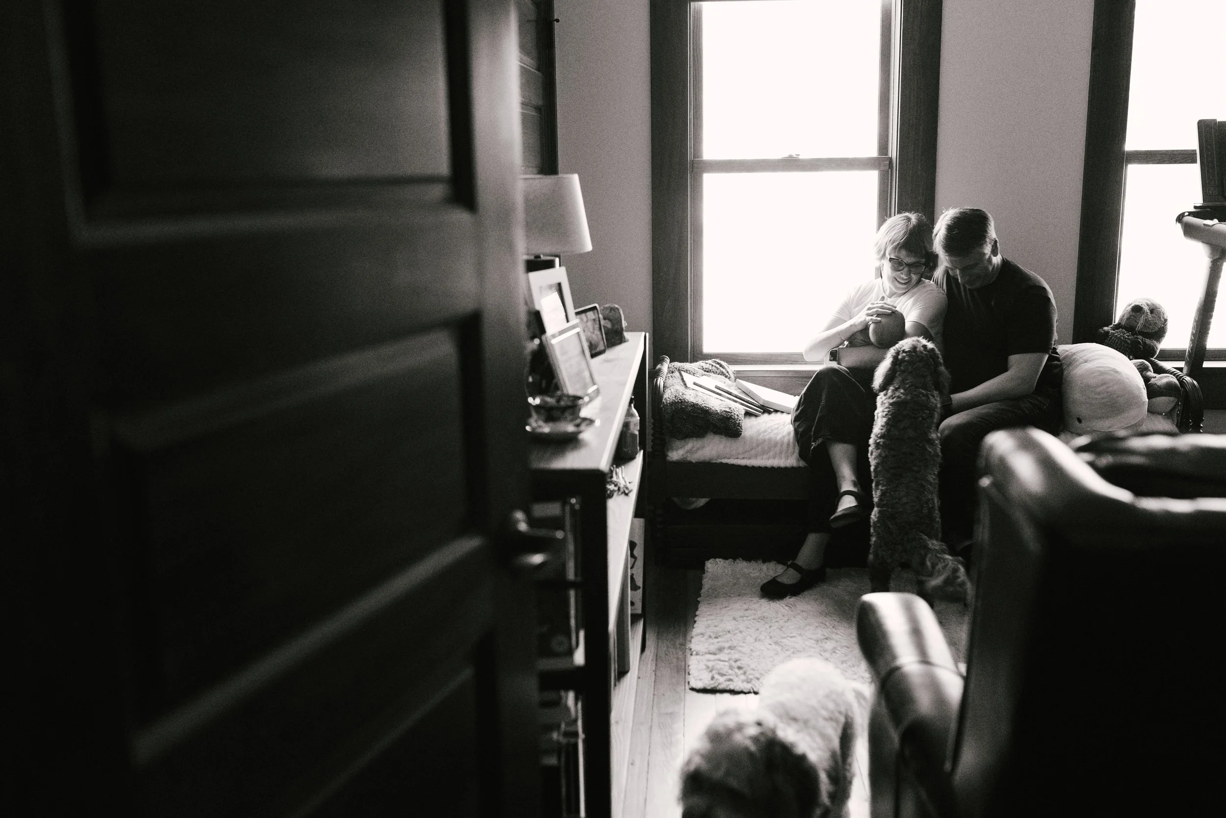 Mother holding newborn during in-home newborn session in Columbus Ohio