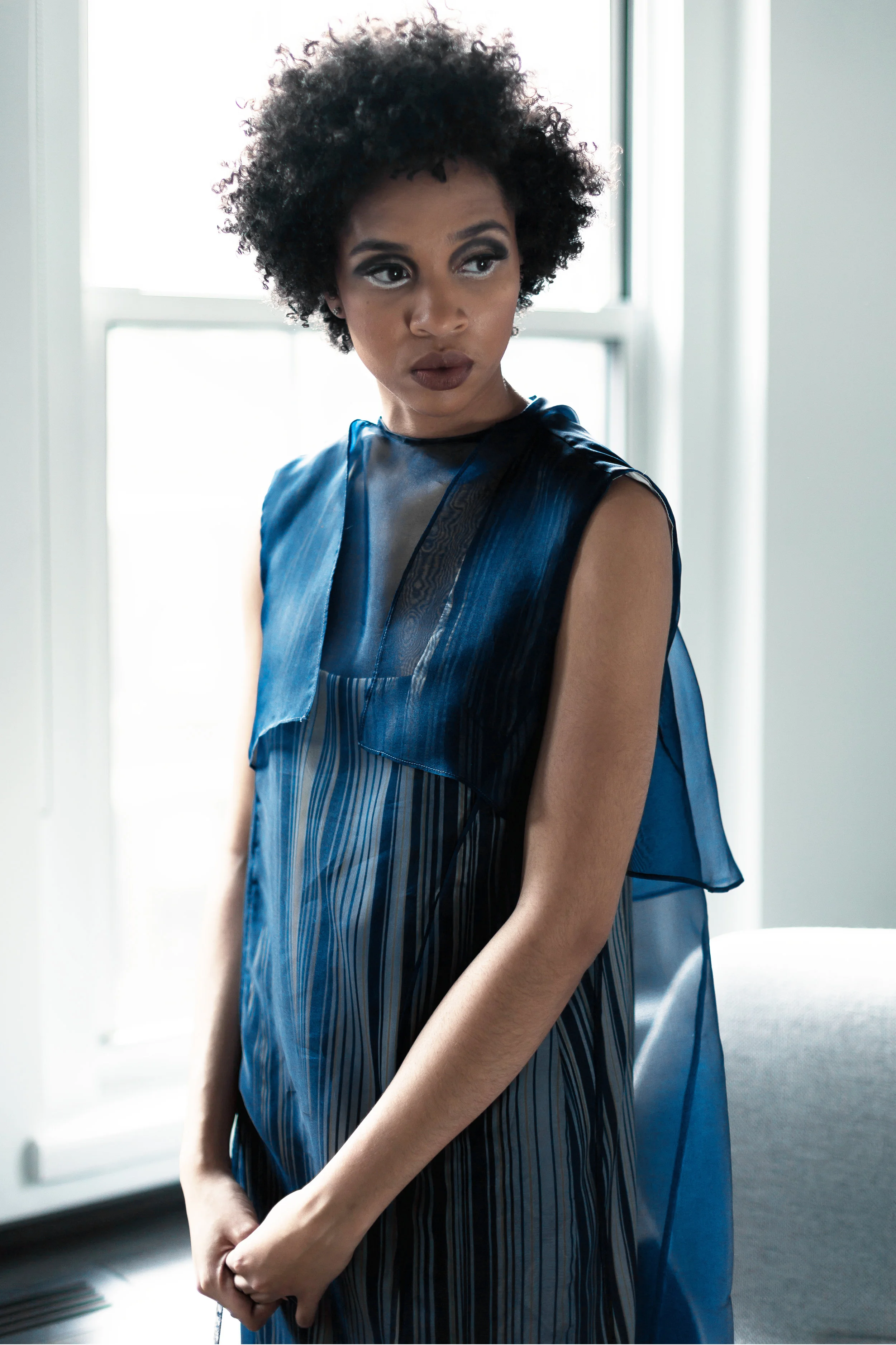 VERONICA sleeveless printed dress with organza overlay on model detail view