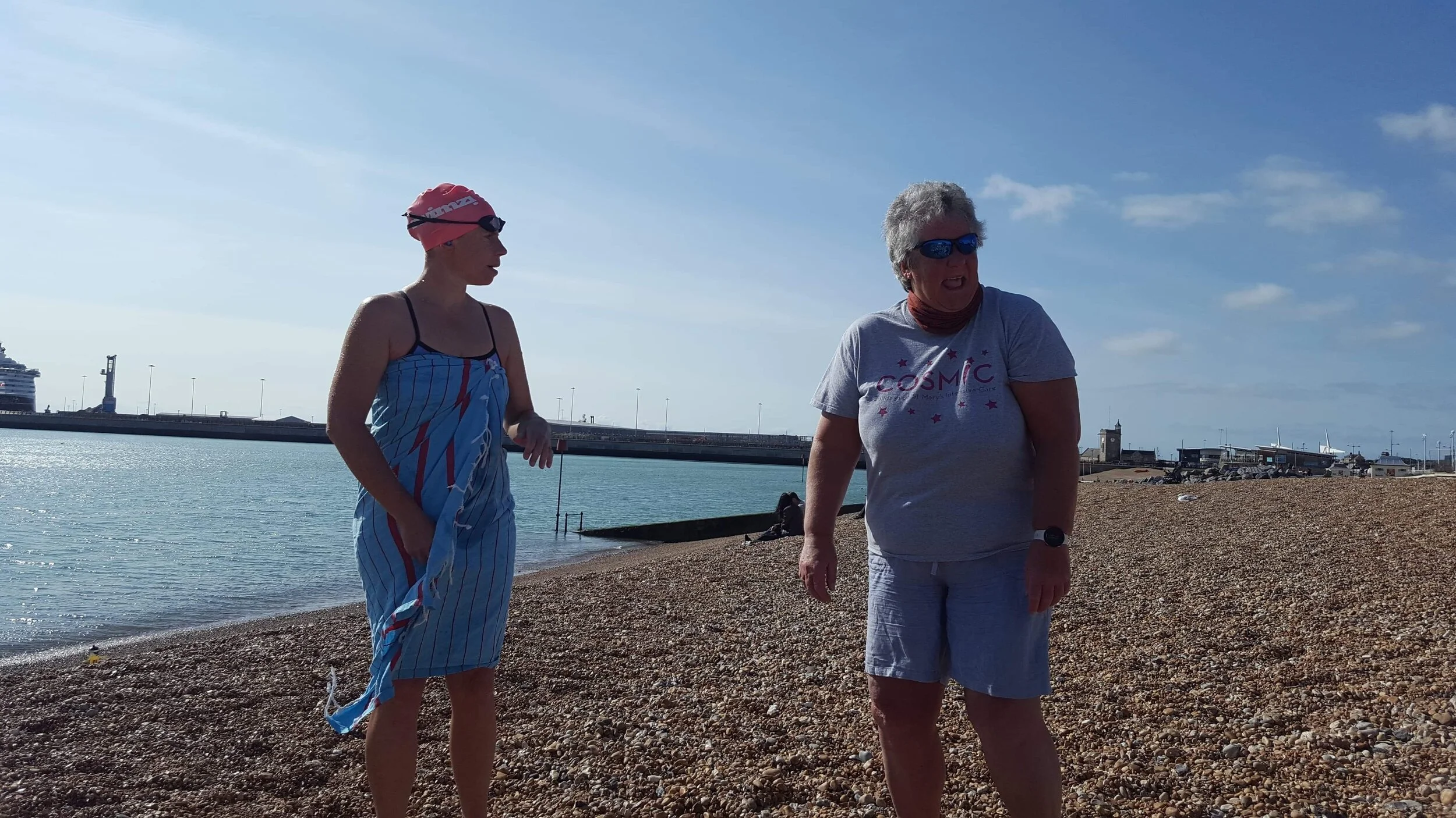 Successful soloist and relay swimmer chatting about their shared experience of the same day.