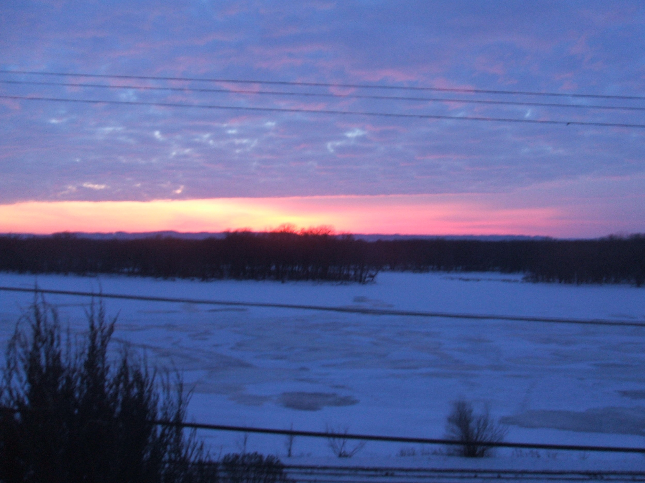 January sunset looking from Alma, Wisconsin towards the Minnesota bluffs
